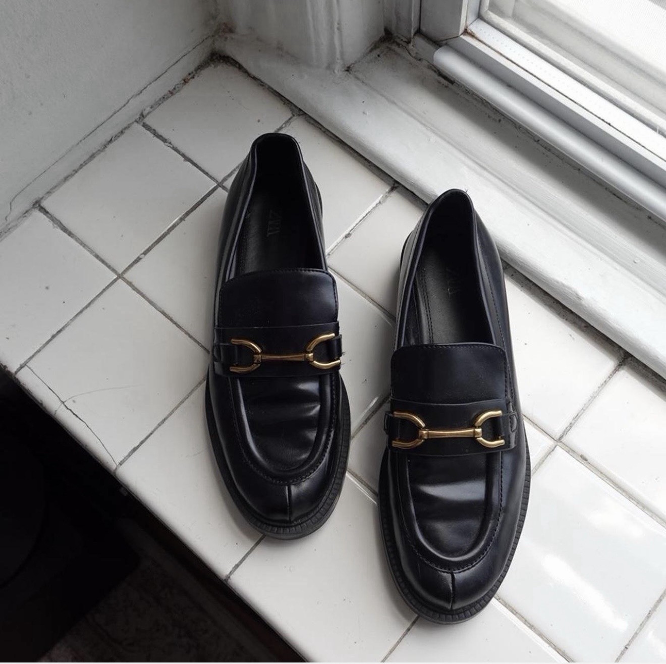 Black leather loafers with gold buckle – size 40 (women’s 9-9.5 US size shoe).