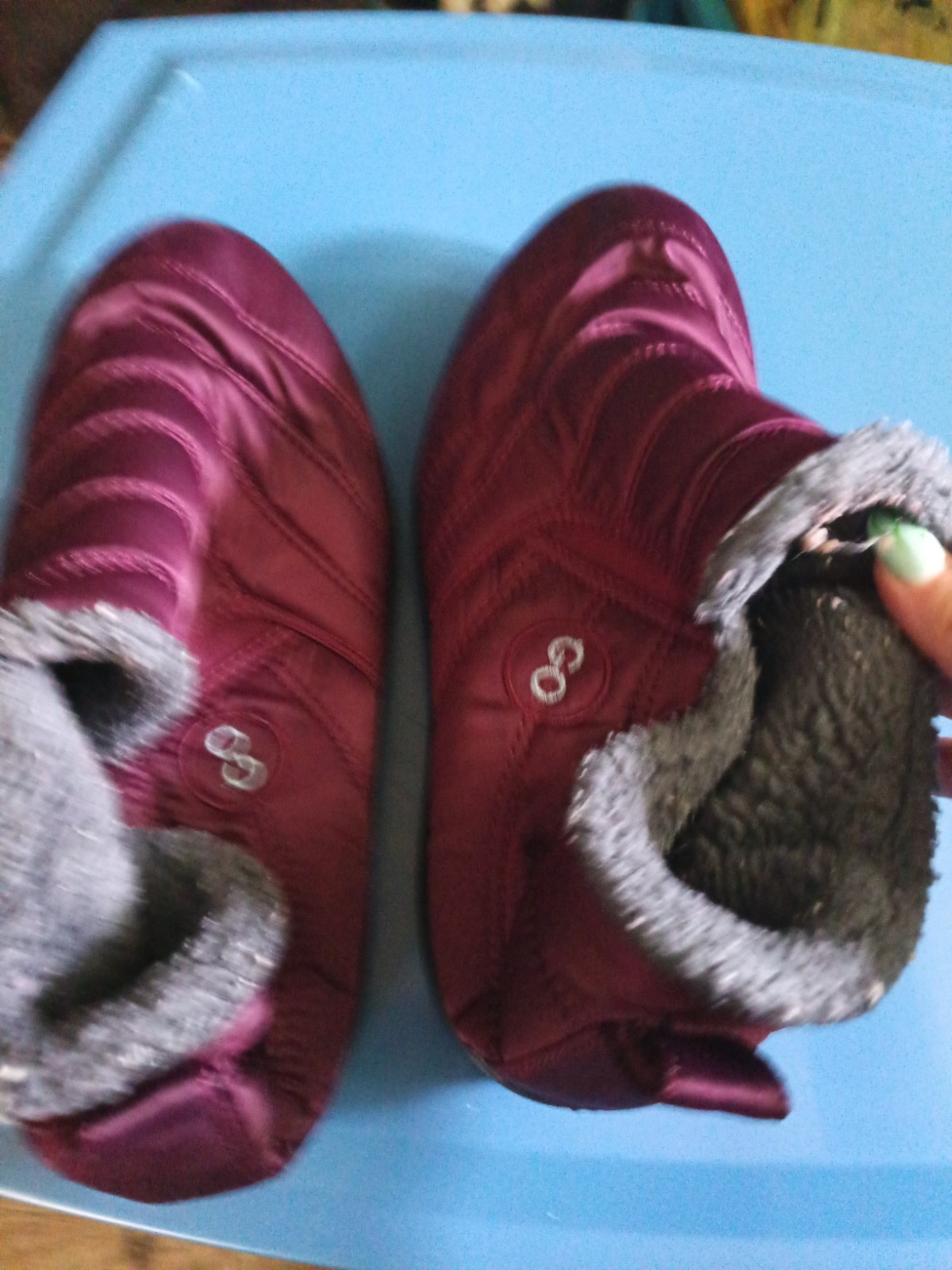 Go brand quilted maroon snow boots feature a plush faux fur lining and a slip-on