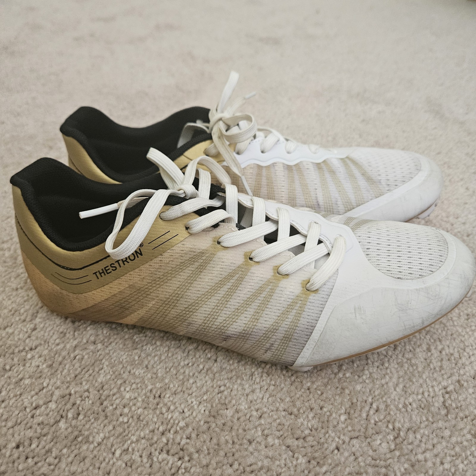 Track Spikes with extra spikes, wrench, and drawstring bag.