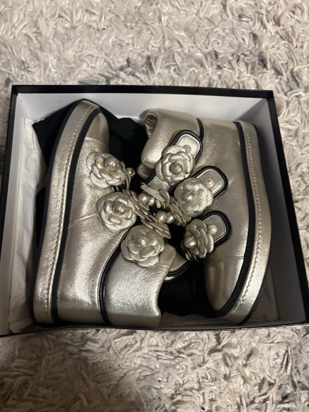 These are Chanel Metallic Gold Leather Camellia CC Logo High-Top Sneakers featur