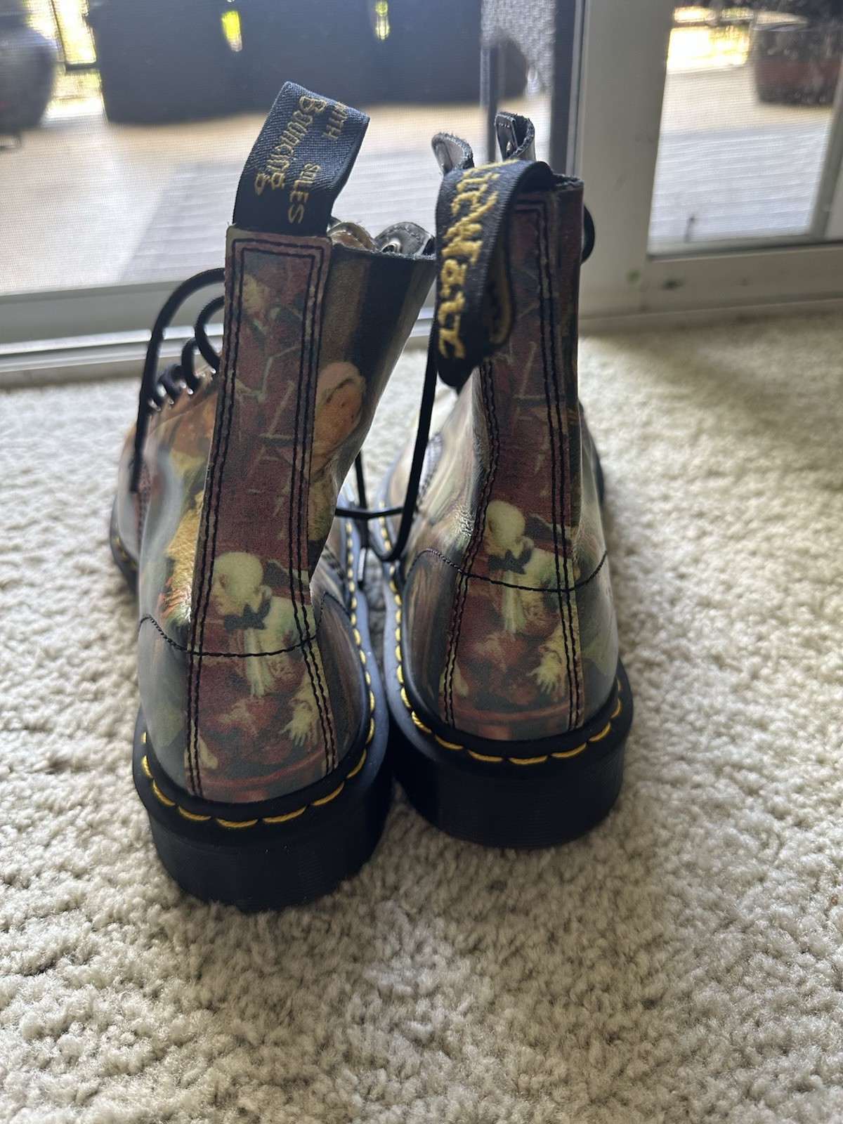 Dr. Martens 1460 Pascal boots with an all-over Renaissance/classical art print.