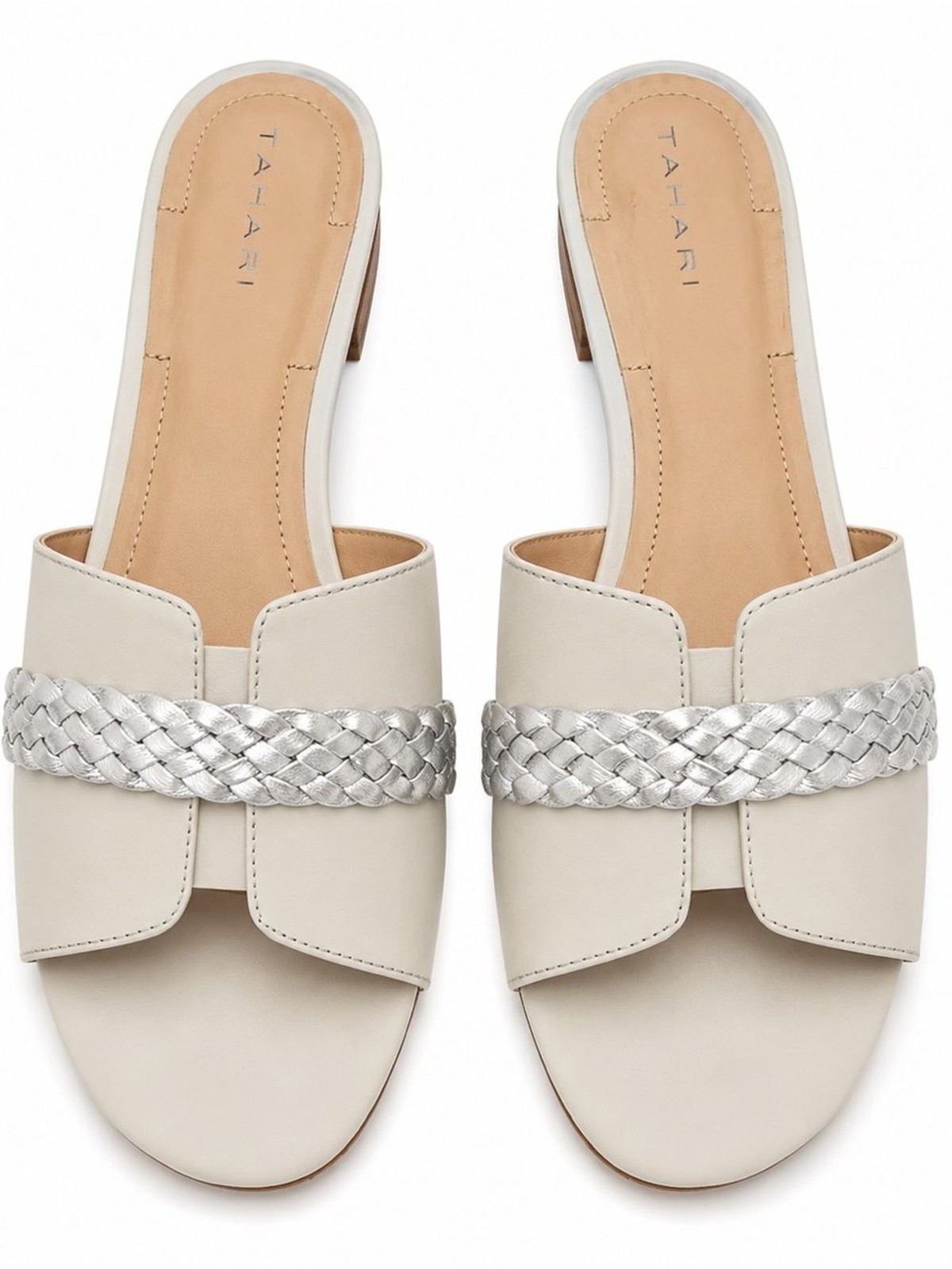 Tahari «Amorie» slide sandals featuring white leather upper silver braided strap