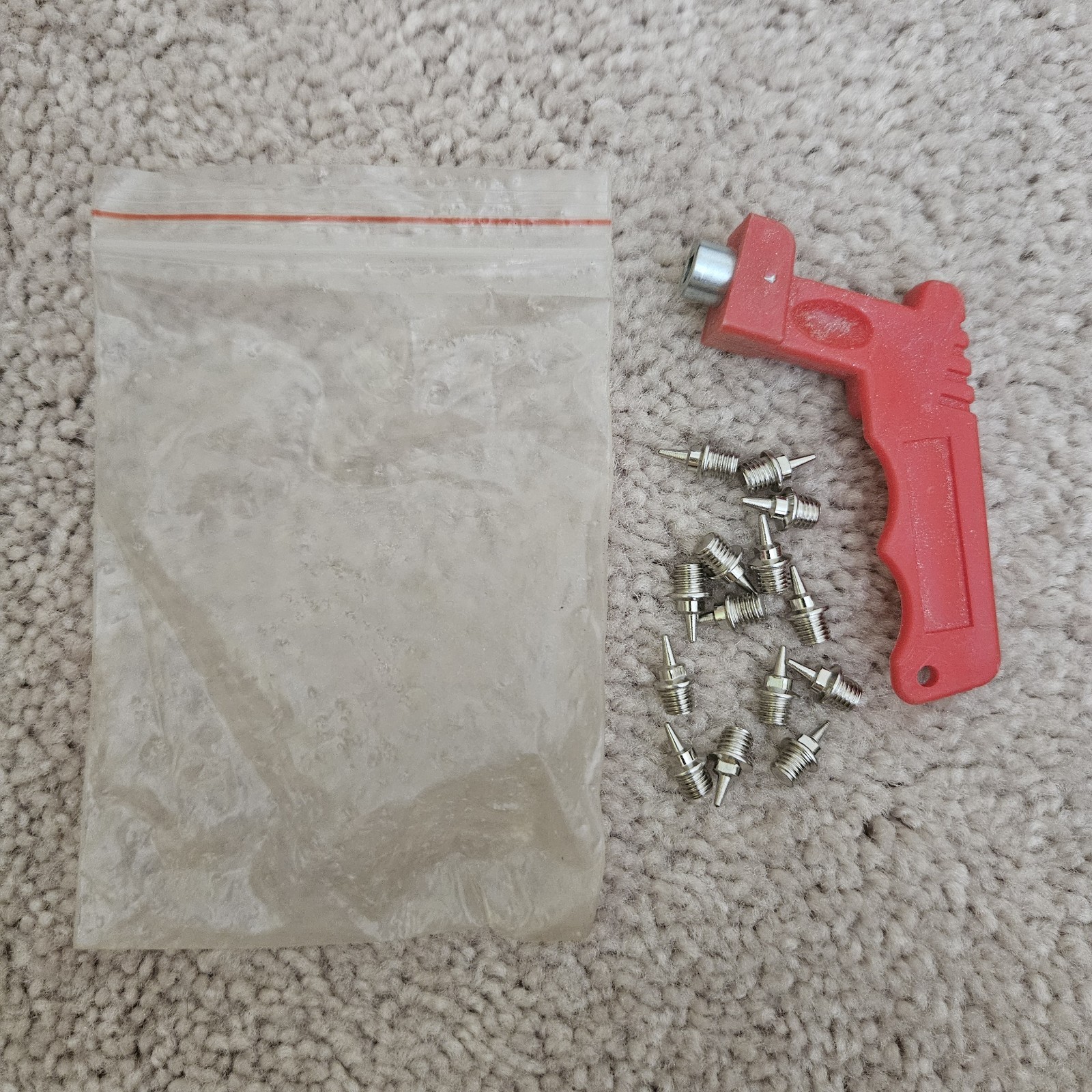 Track Spikes with extra spikes, wrench, and drawstring bag.