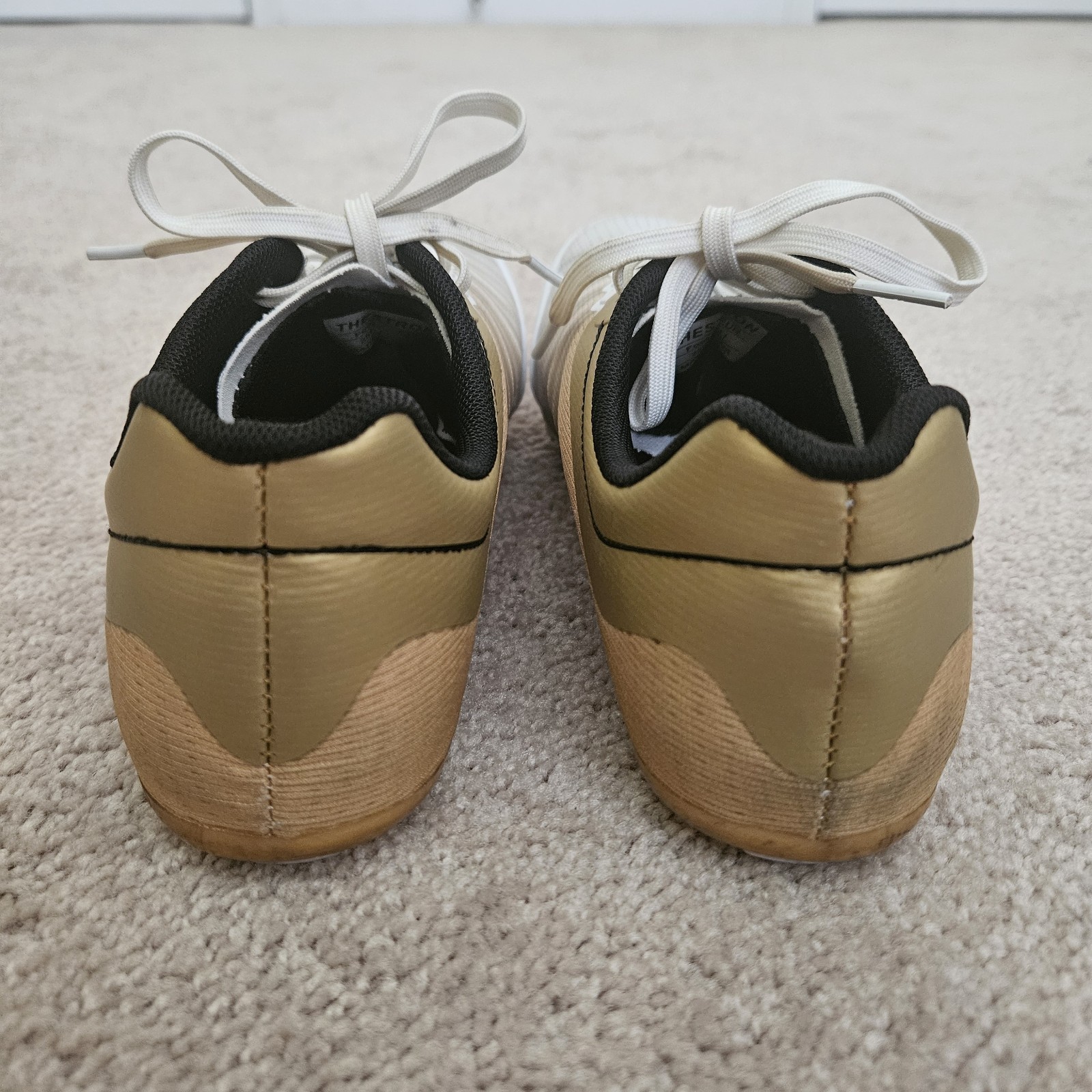 Track Spikes with extra spikes, wrench, and drawstring bag.