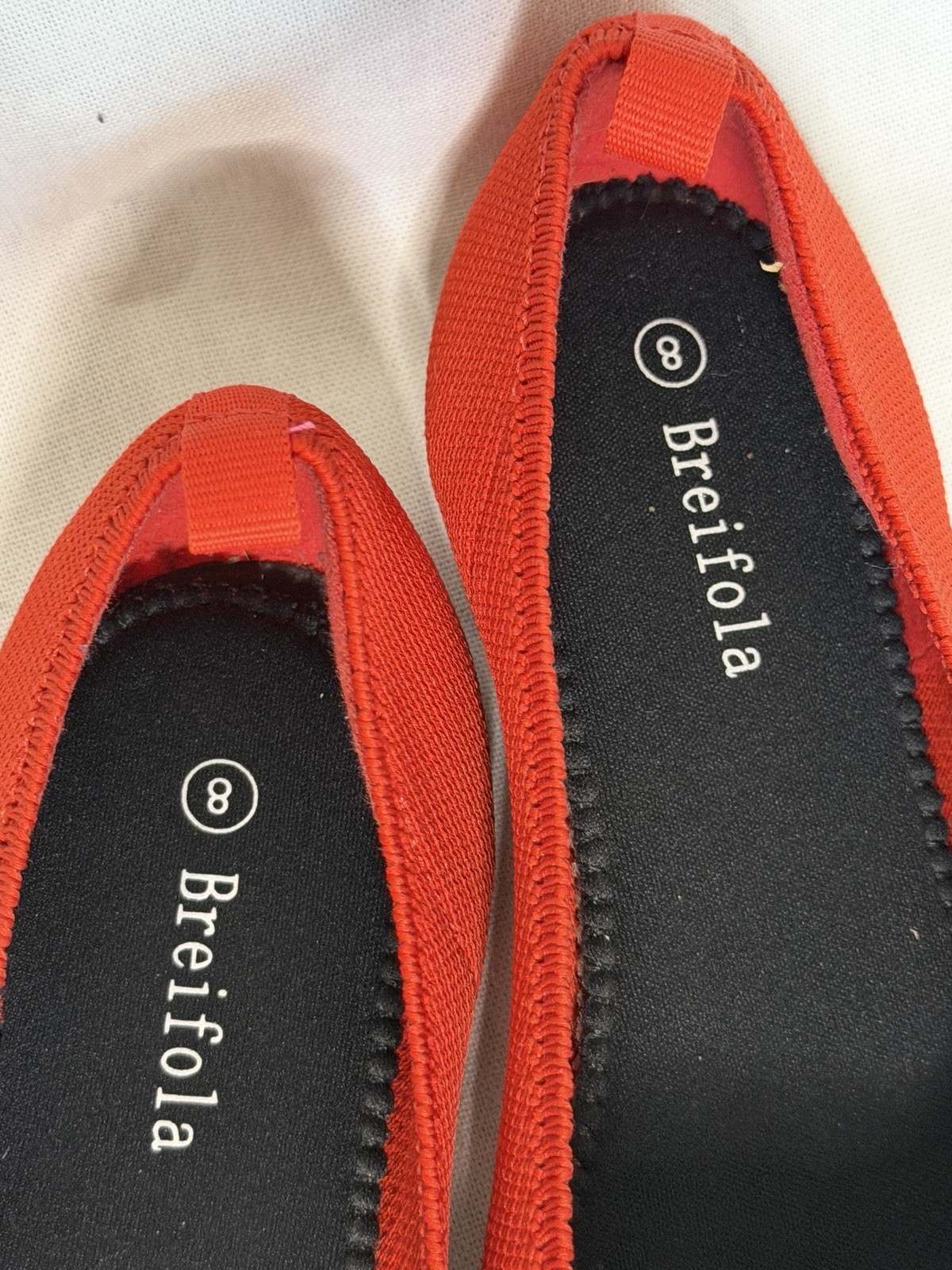 Breifola pointed-toe ballet flats in red with a textile knit upper.