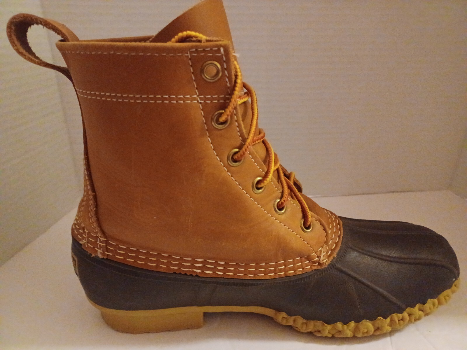 L.L. Bean Boots Duck Boots Feature A Lace Up Closure With Pull Tab On Back.
