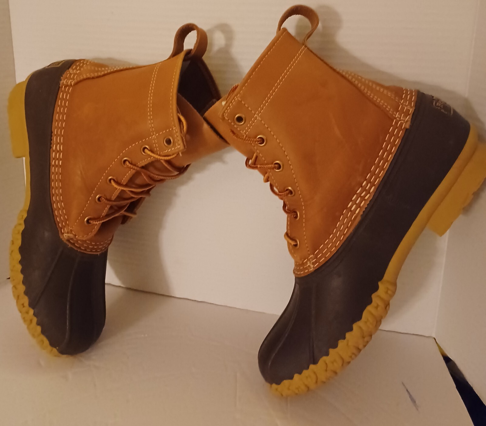 L.L. Bean Boots Duck Boots Feature A Lace Up Closure With Pull Tab On Back.