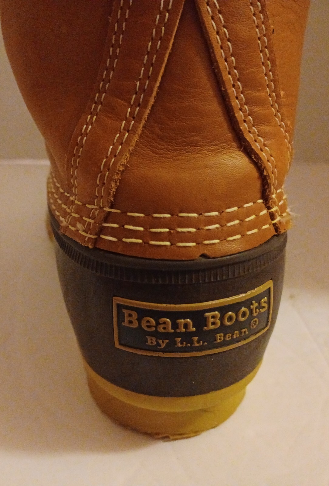 L.L. Bean Boots Duck Boots Feature A Lace Up Closure With Pull Tab On Back.