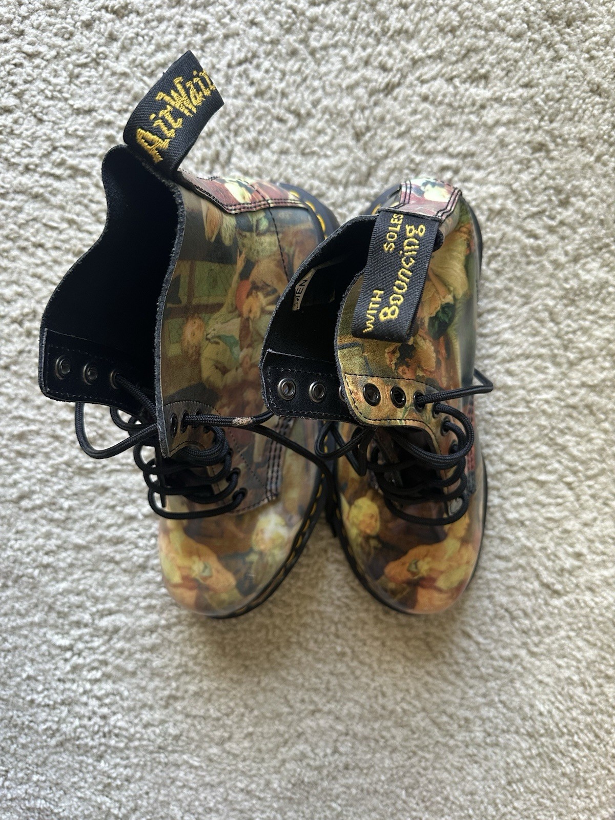 Dr. Martens 1460 Pascal boots with an all-over Renaissance/classical art print.