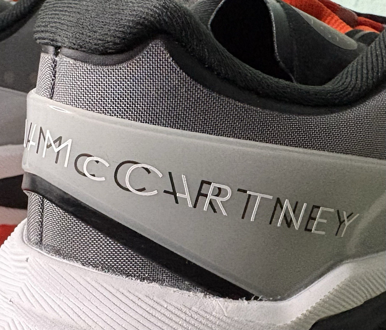 US W 8/M 7 – Stella McCartney x Adidas Barricade “Charcoal Orange” JR3285