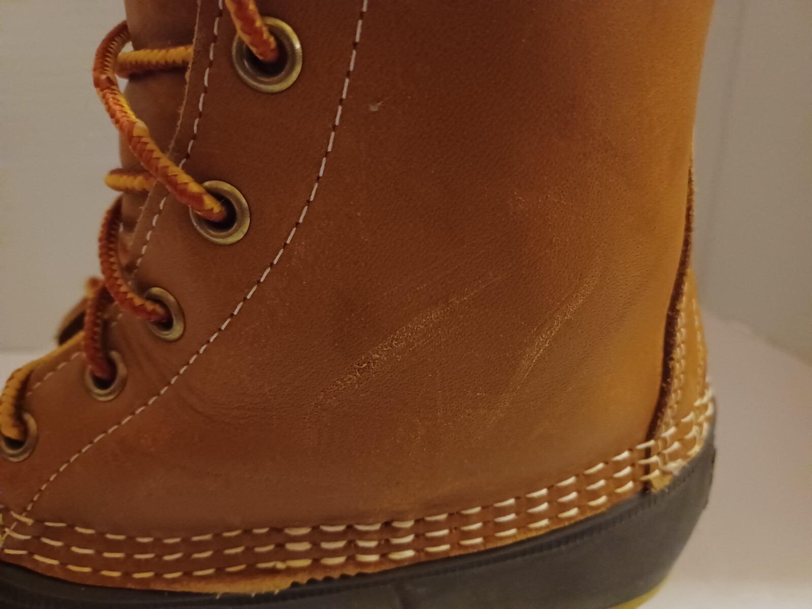 L.L. Bean Boots Duck Boots Feature A Lace Up Closure With Pull Tab On Back.