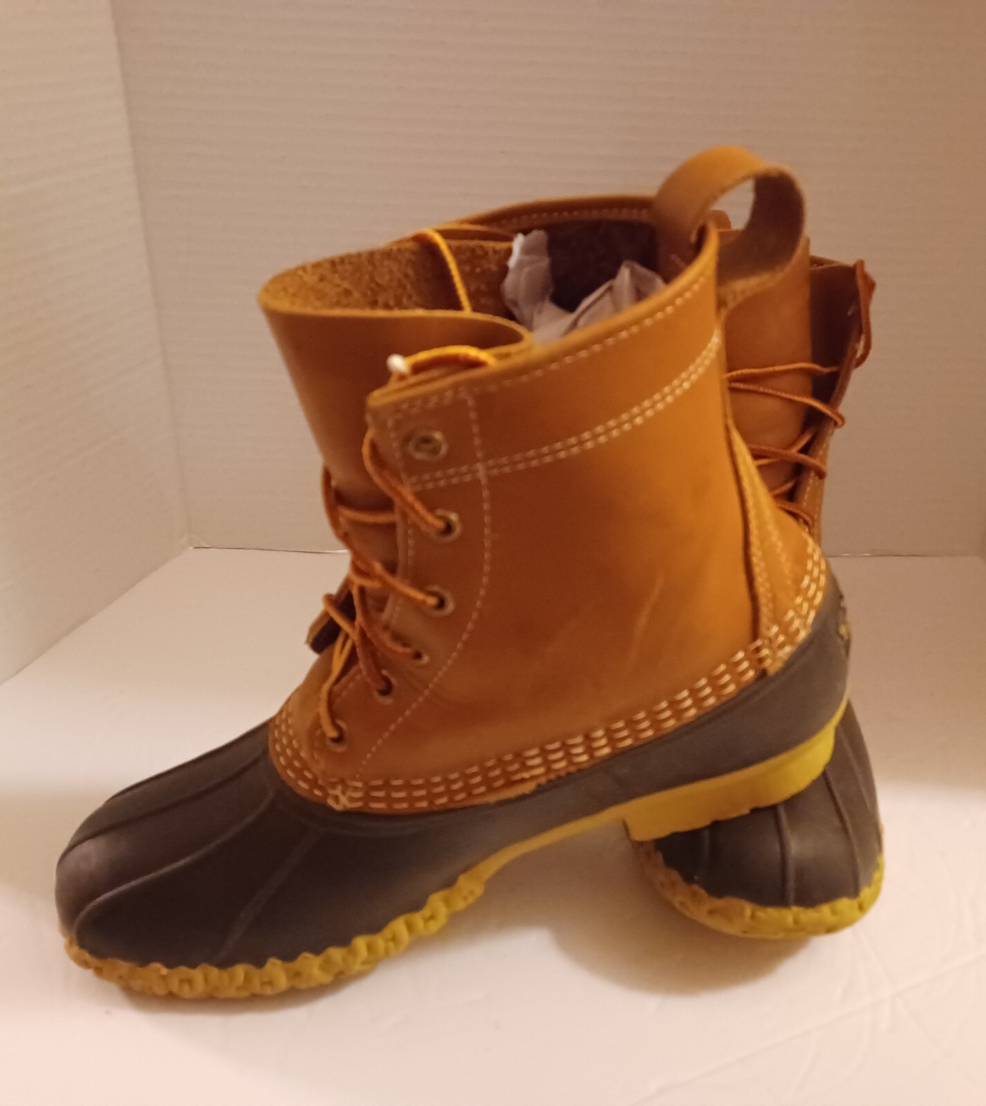 L.L. Bean Boots Duck Boots Feature A Lace Up Closure With Pull Tab On Back.
