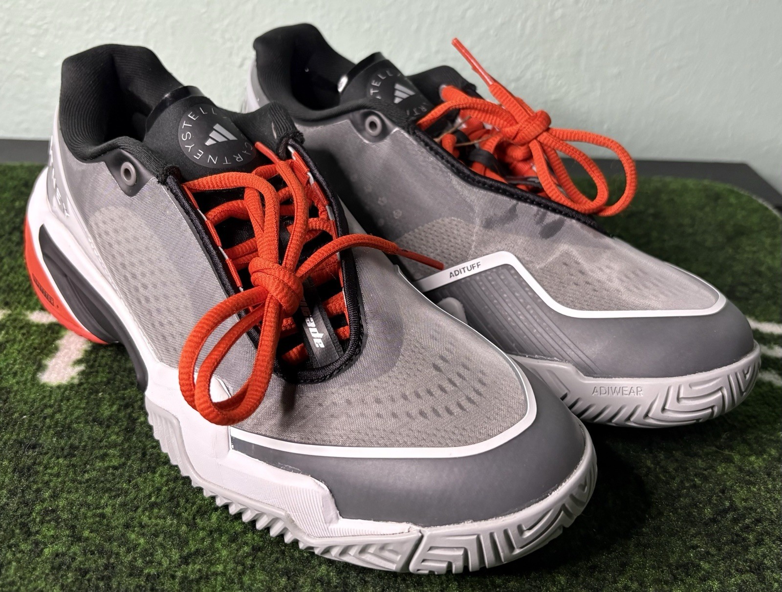 US W 8/M 7 – Stella McCartney x Adidas Barricade “Charcoal Orange” JR3285