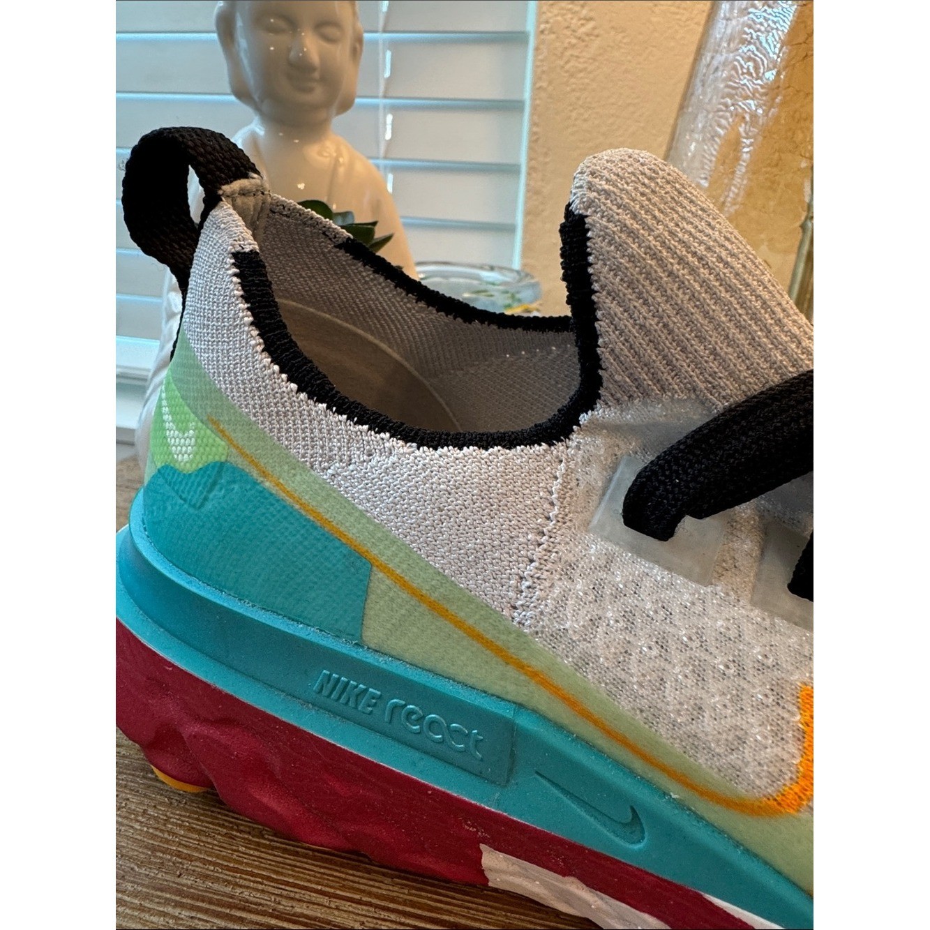 Nike React Infinity White Athletic Sneakers with Teal, Yellow & Red Accents