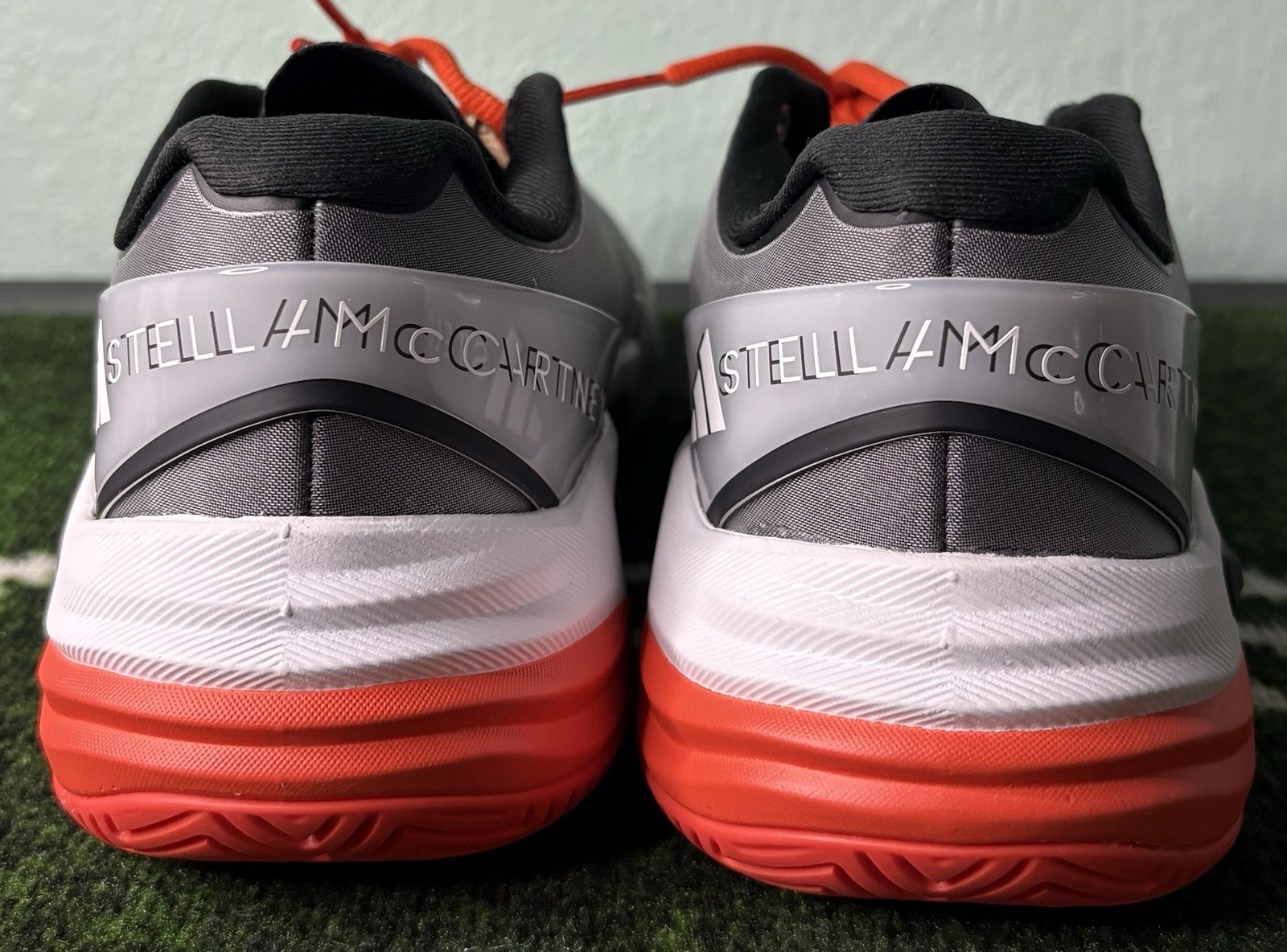 US W 8/M 7 – Stella McCartney x Adidas Barricade “Charcoal Orange” JR3285