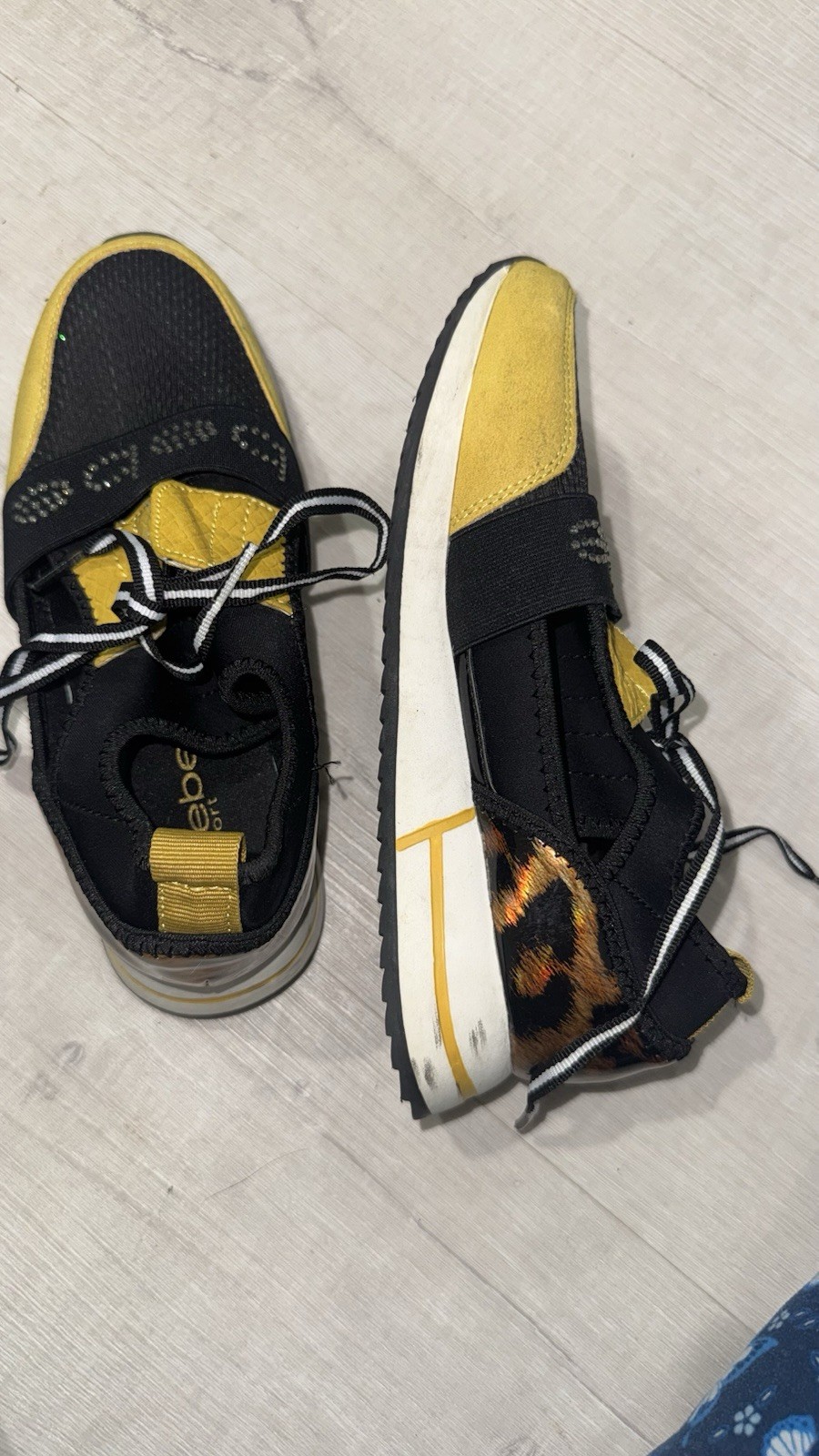 bebe Black/Yellow Low Top Lace-Up Athletic Sneakers with Animal Print