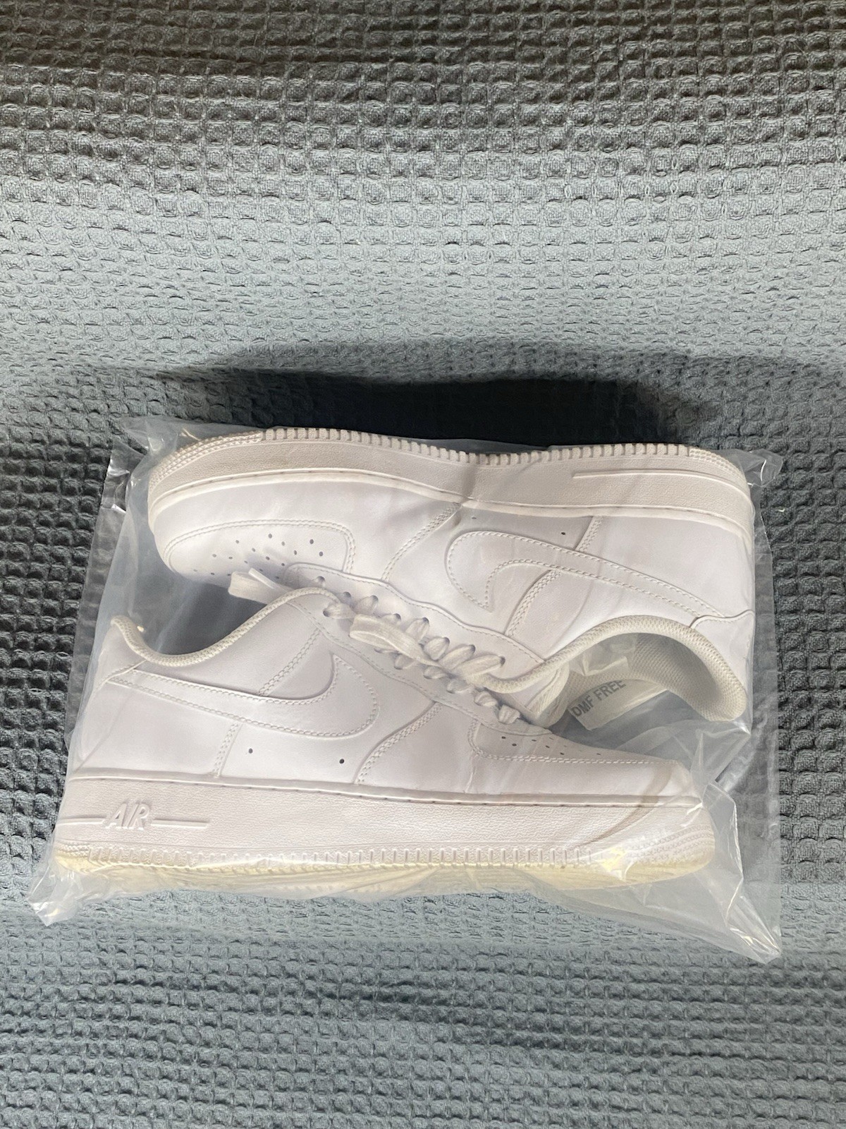 Nike Air Force 1 Triple White/White/White Low Top Lace-Up Leather Sneaker