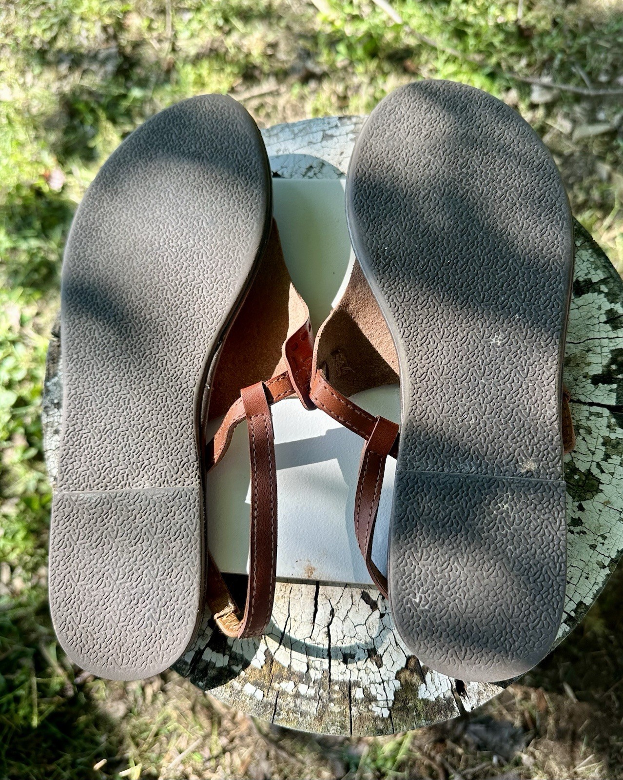 brown Mudd sandals feature intricate embossed paisley designs on the front strap