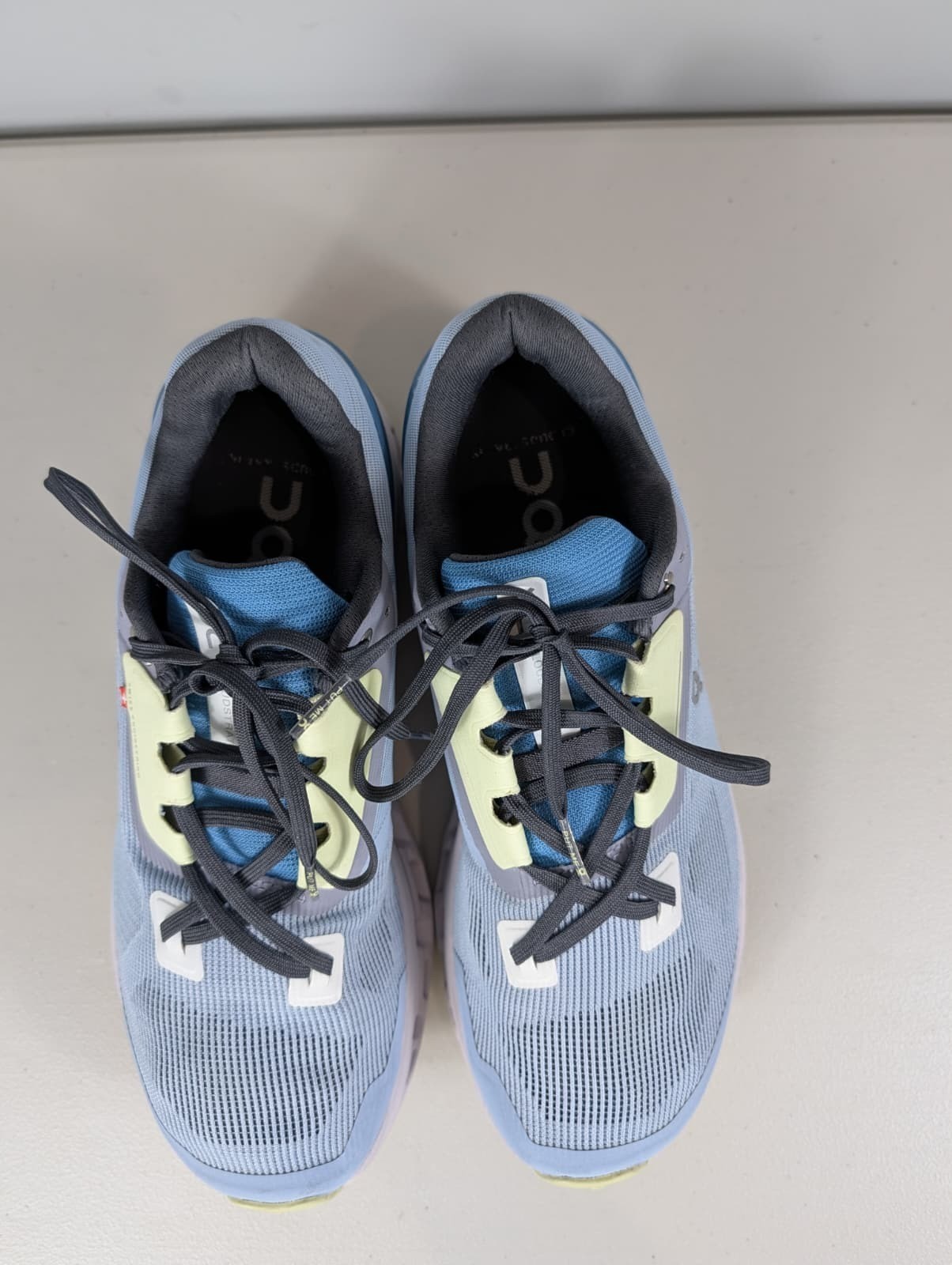 On cloud stratus sneakers in a chambray/lavender blue color women’s size 10W