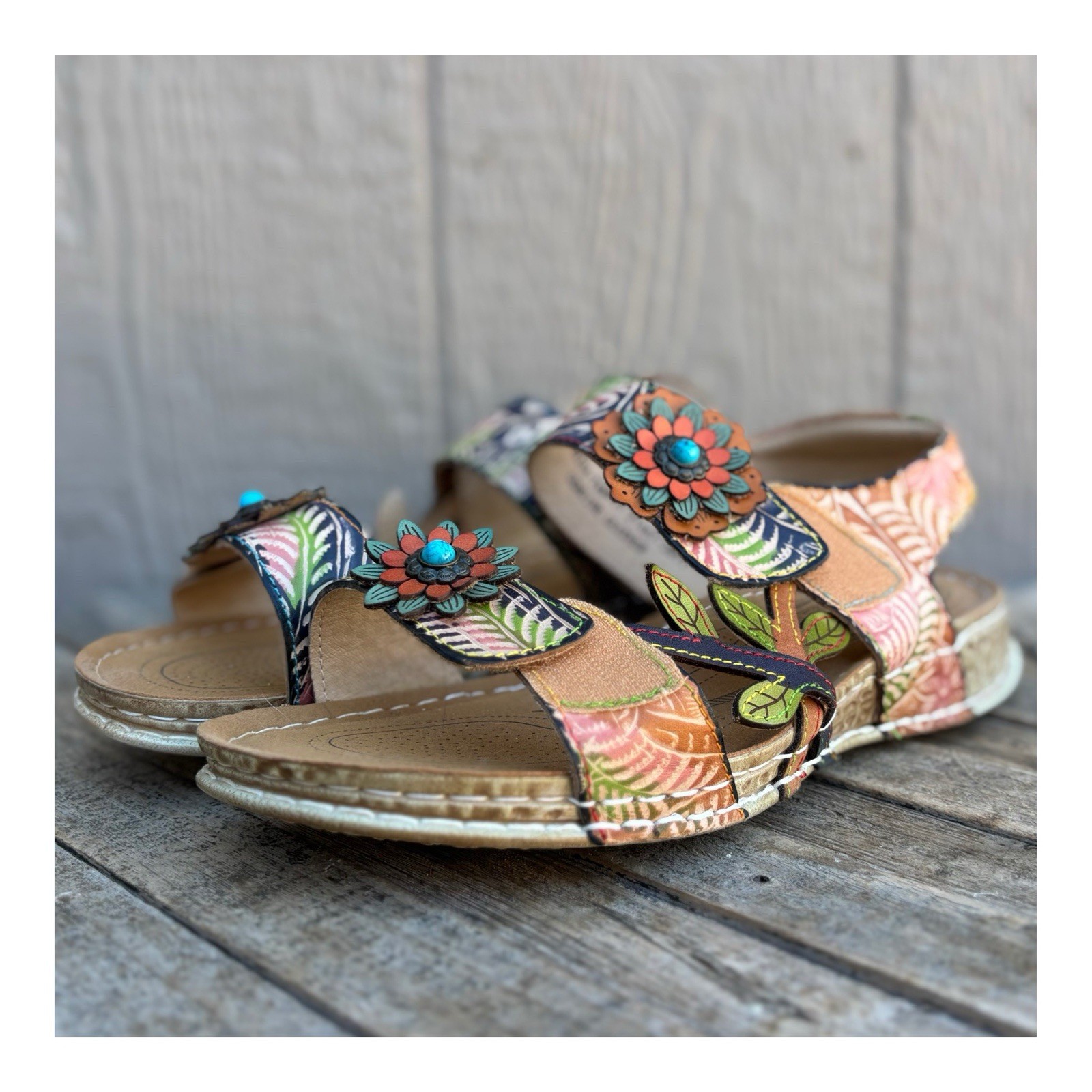 L’Artiste by Spring Step leather sandals with decorative floral embellishments