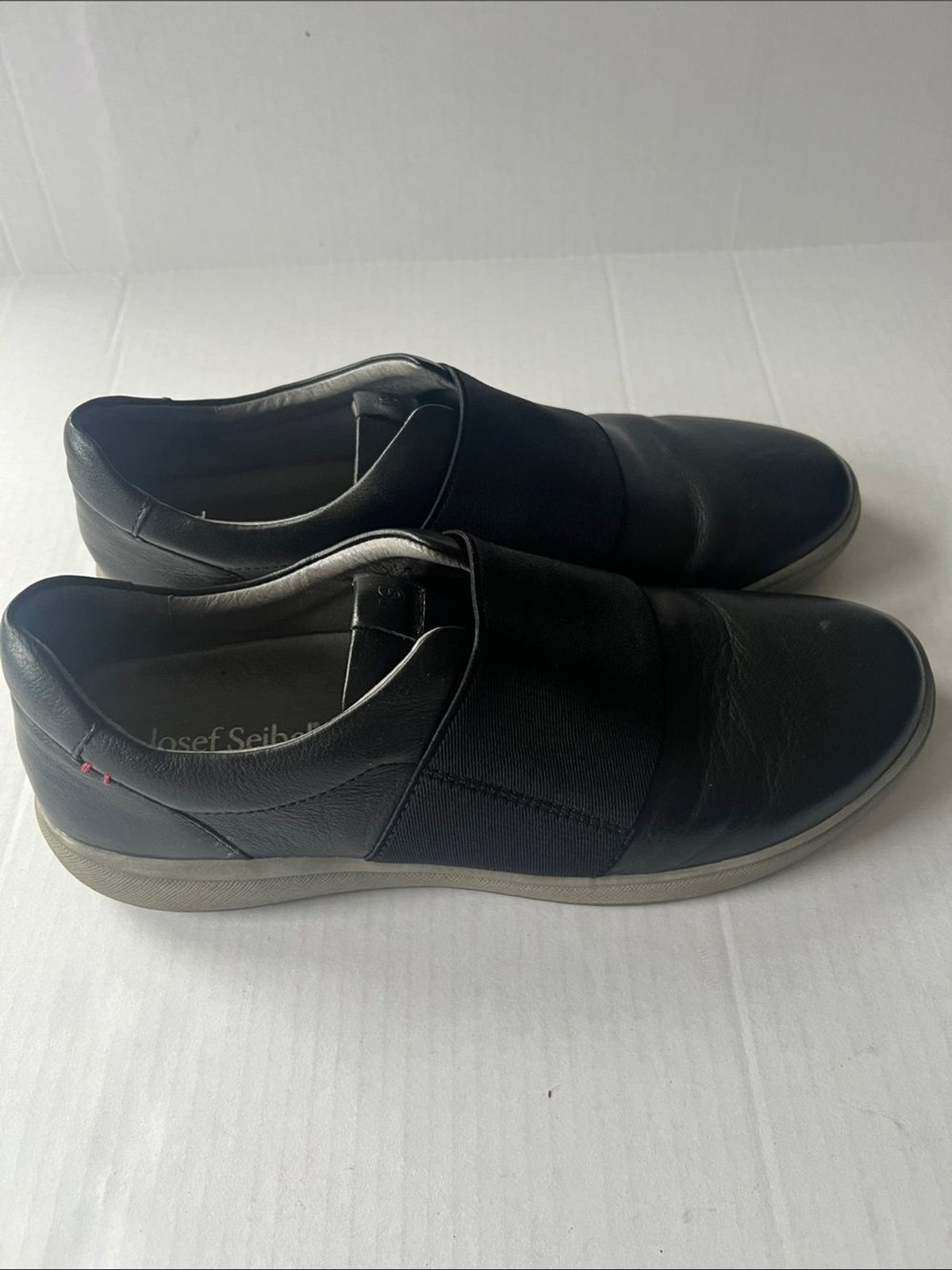 Josef Seibel Caren 14 sneakers black leather upper wide elastic vamp strap.