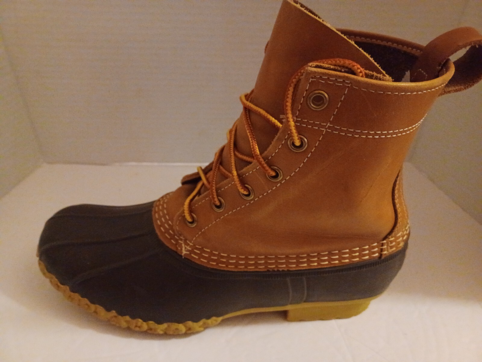 L.L. Bean Boots Duck Boots Feature A Lace Up Closure With Pull Tab On Back.