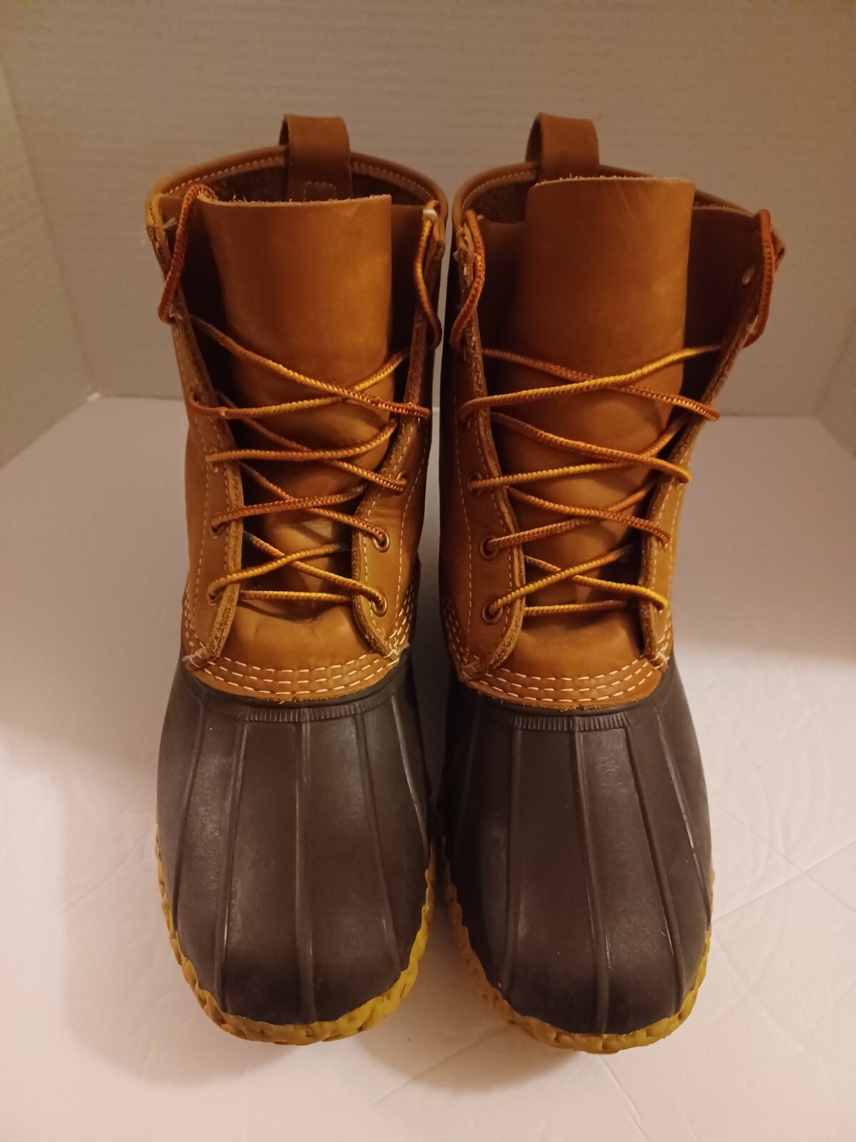 L.L. Bean Boots Duck Boots Feature A Lace Up Closure With Pull Tab On Back.