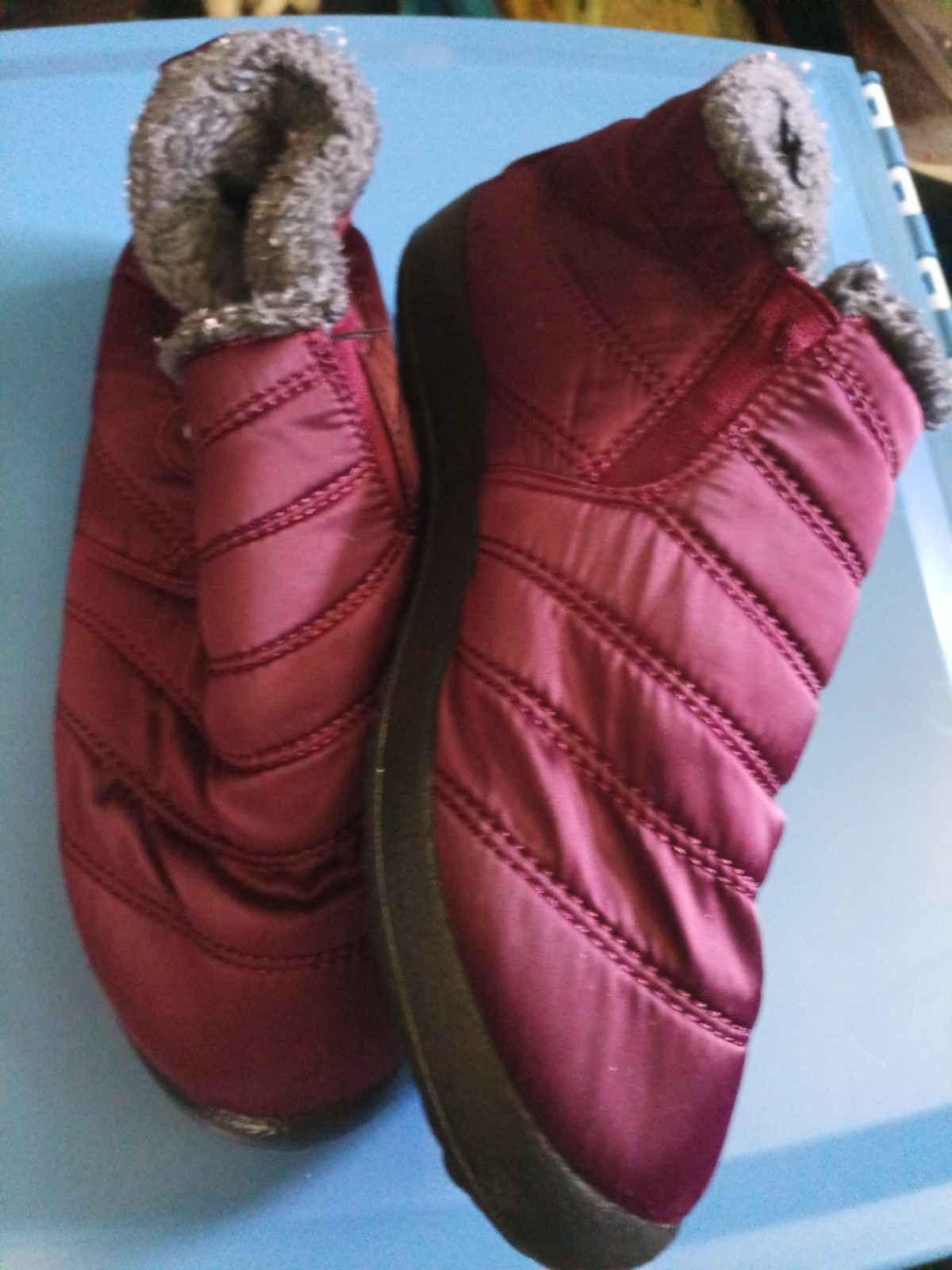 Go brand quilted maroon snow boots feature a plush faux fur lining and a slip-on
