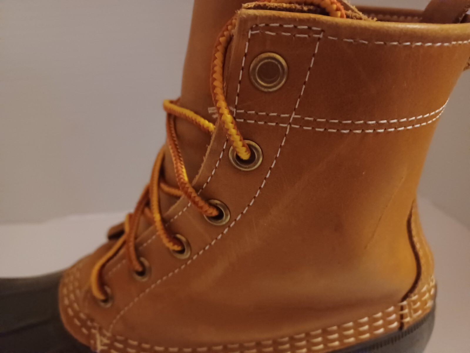 L.L. Bean Boots Duck Boots Feature A Lace Up Closure With Pull Tab On Back.