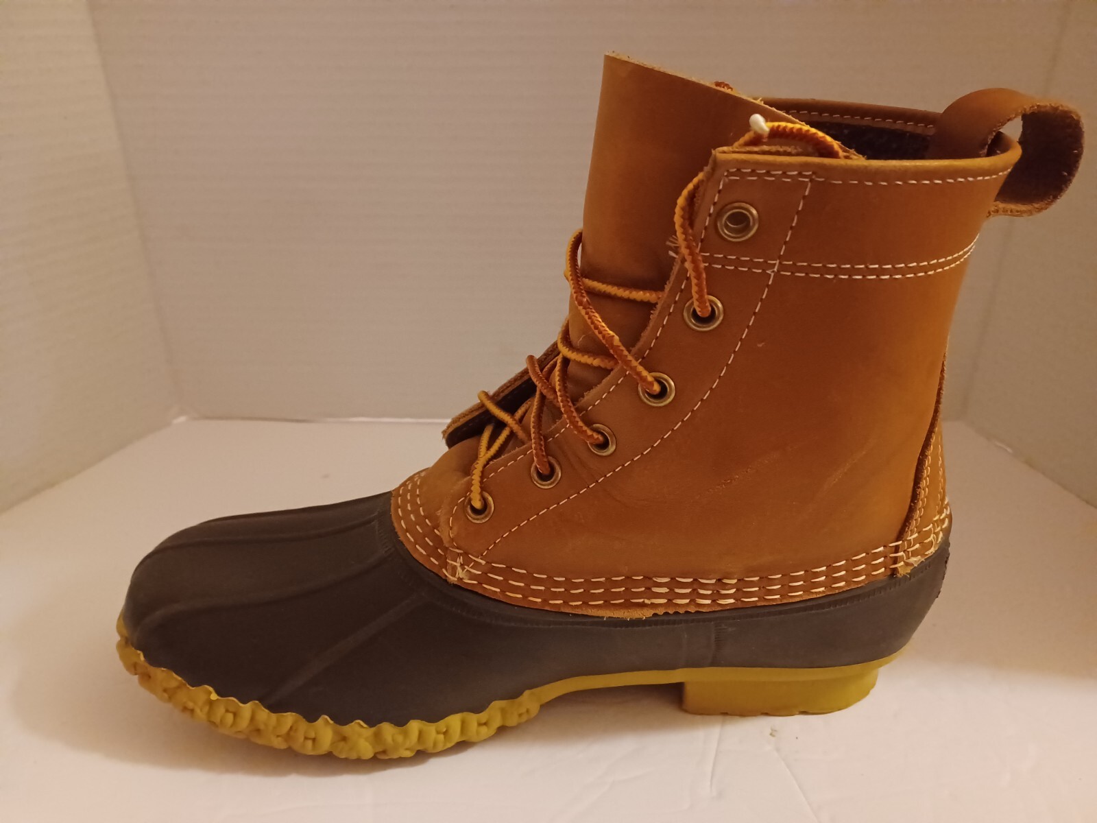 L.L. Bean Boots Duck Boots Feature A Lace Up Closure With Pull Tab On Back.