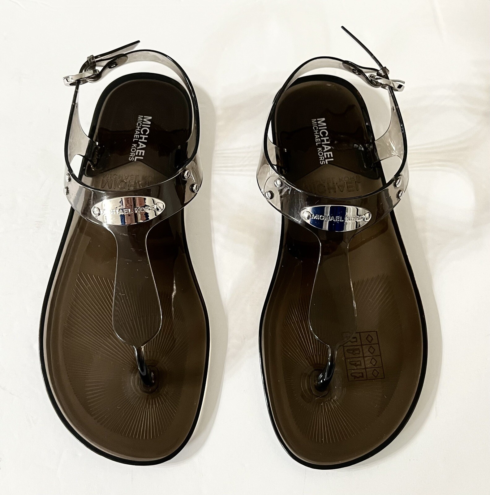 Women Michael Kors MK Plate Jelly Flat Buckle Up Sandals PVC Smoke