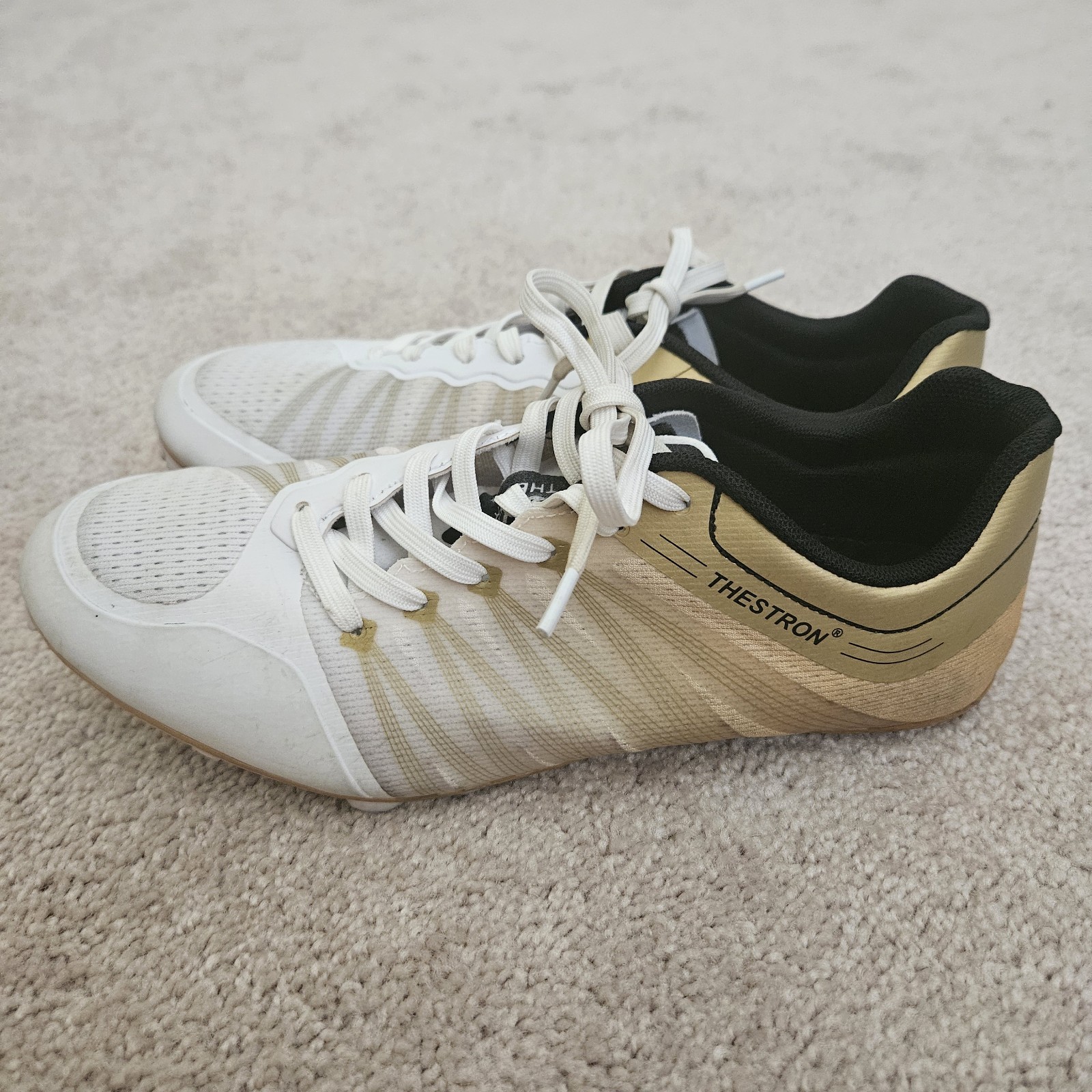 Track Spikes with extra spikes, wrench, and drawstring bag.