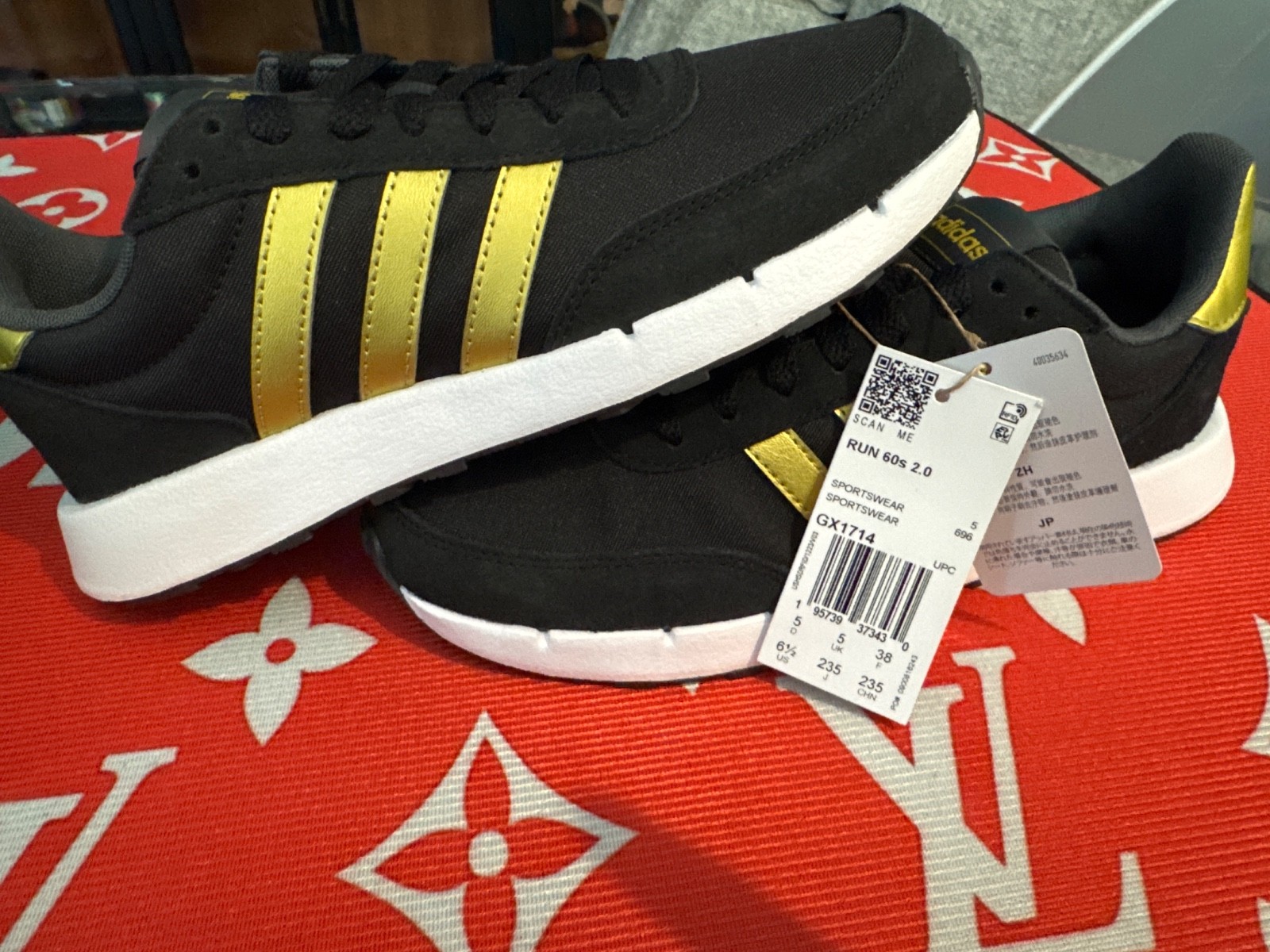 Adidas Run 60s 2.0 sneakers in black with metallic gold stripes