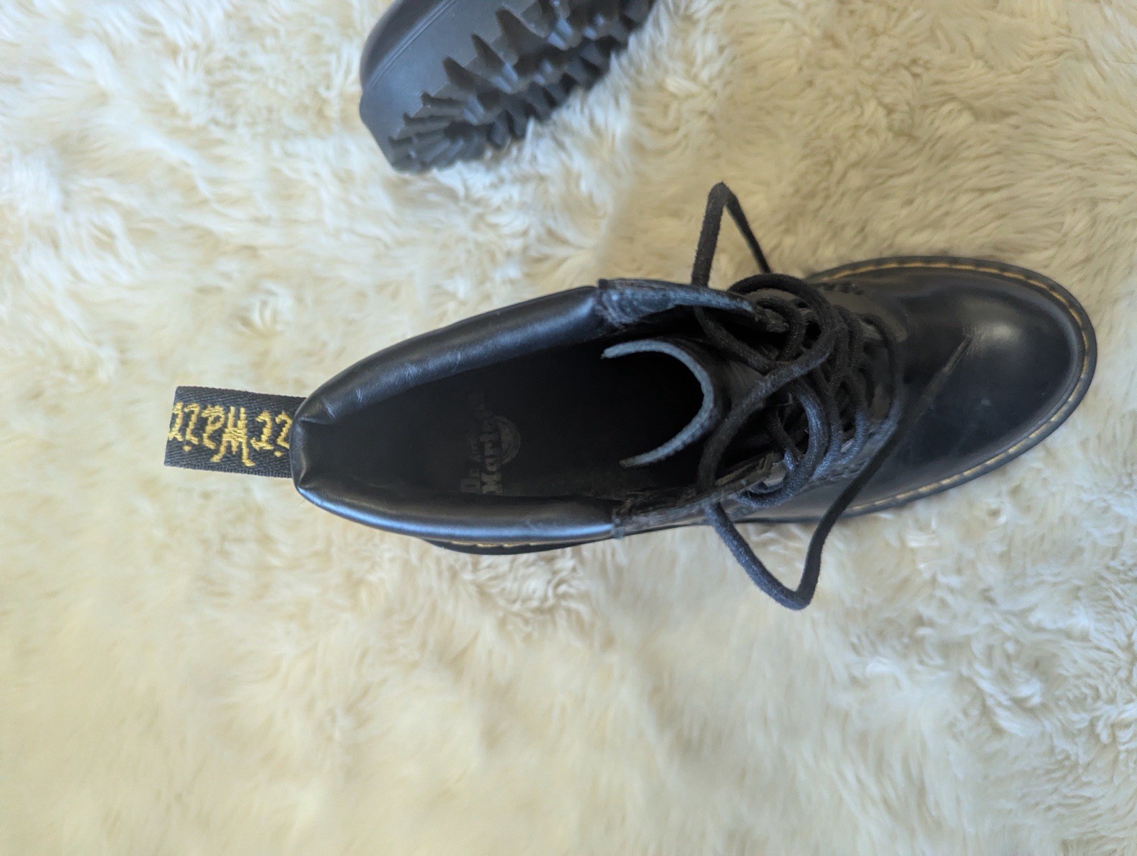 Black leather Dr. Martens Persephone heeled boots featuring a padded collar US 7