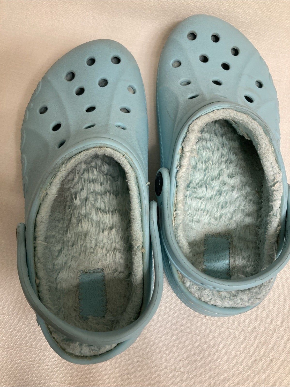 Crocs Baya Lined Clog in light blue, featuring a cozy faux fur interior for warm