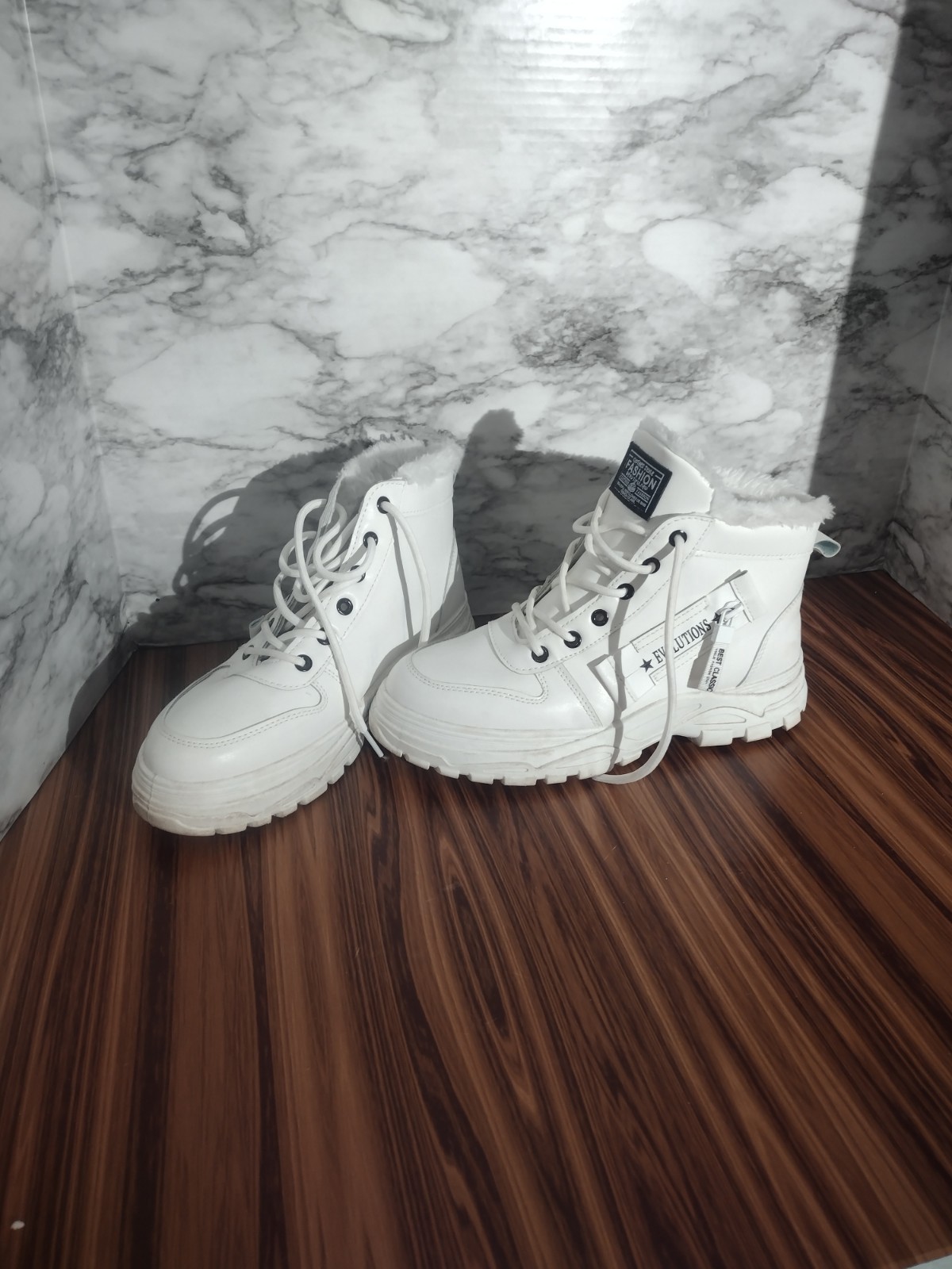 evolutions white fur lined low top boots