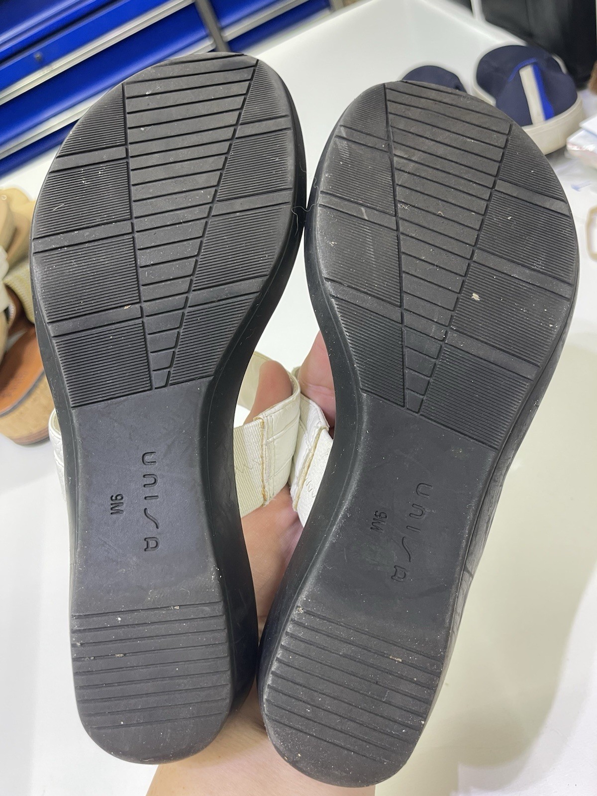 Unisa brand white mules featuring a gold-tone metal detail. Sz 9w