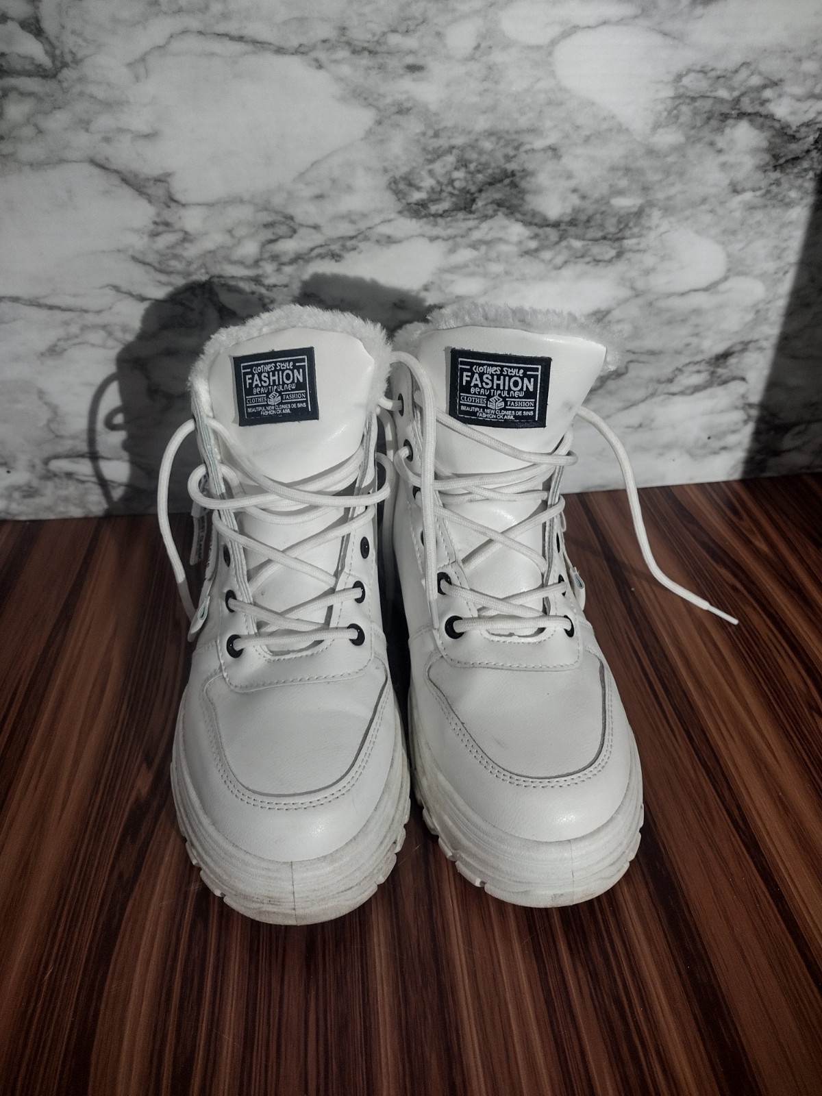 evolutions white fur lined low top boots