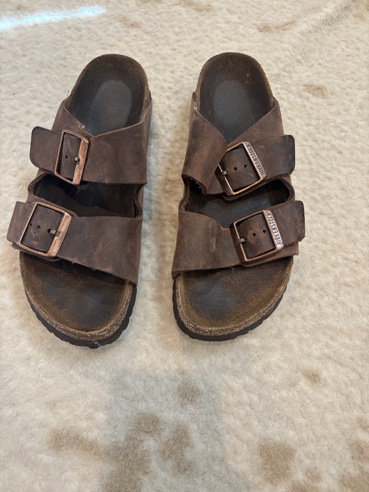 Size 37 Birkenstocks. Dark Colored With Gold Buckles.