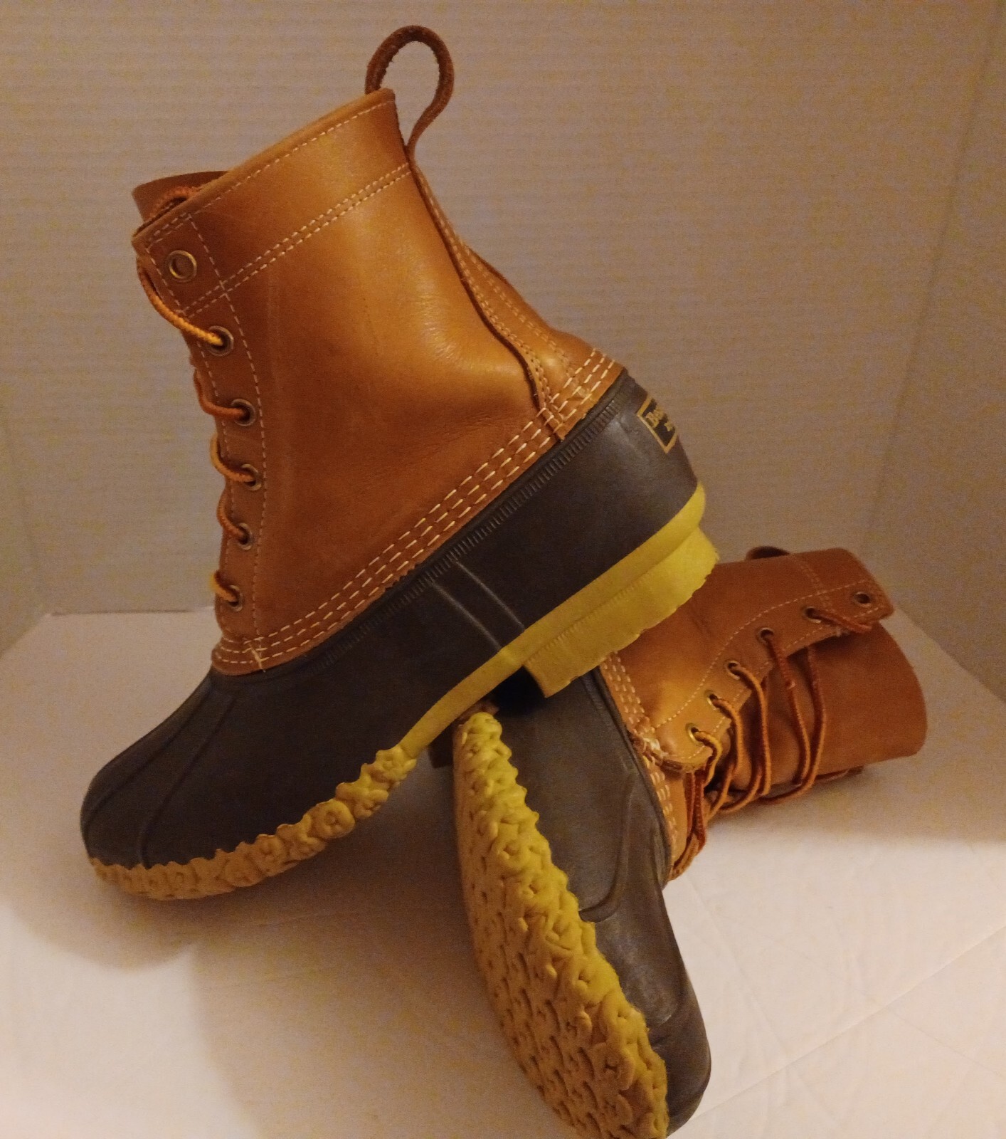 L.L. Bean Boots Duck Boots Feature A Lace Up Closure With Pull Tab On Back.