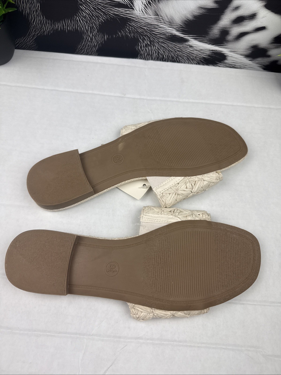 Step into effortless style and comfort with these beautiful woven slide sandals