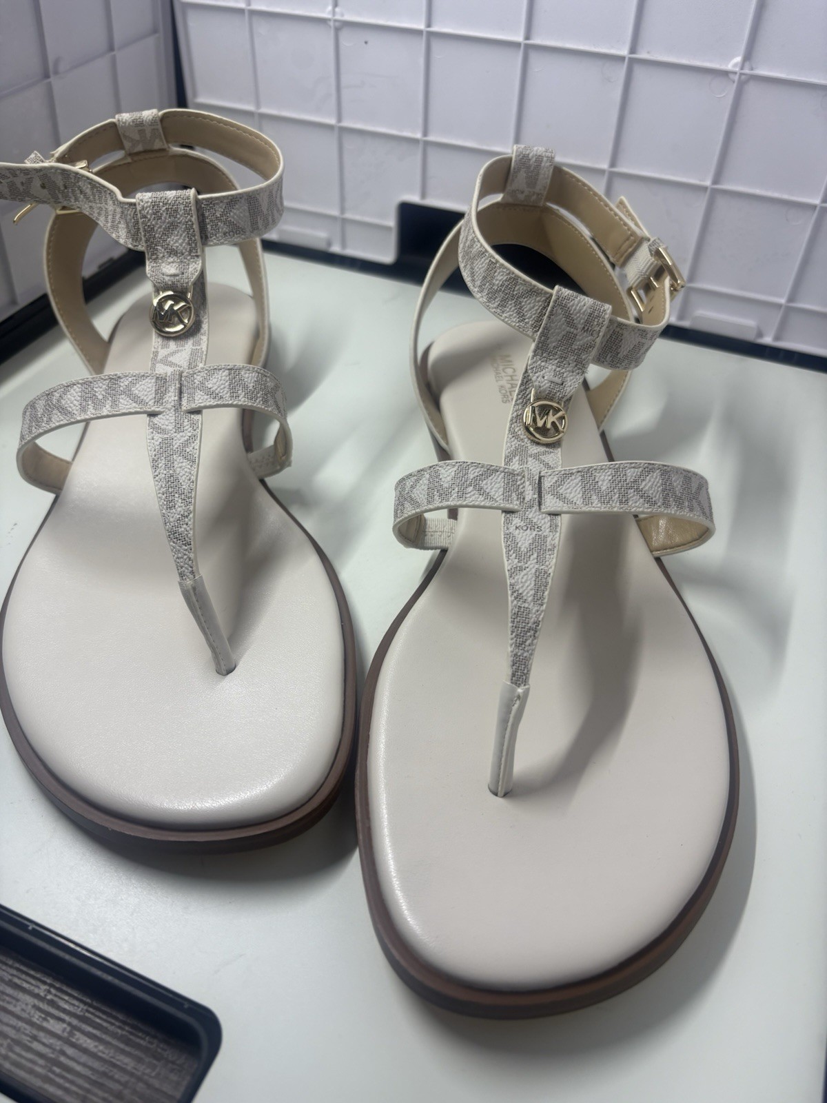 Michael Kors 11 cream/tan MK Logo T-Strap Sandals with Gold Accent