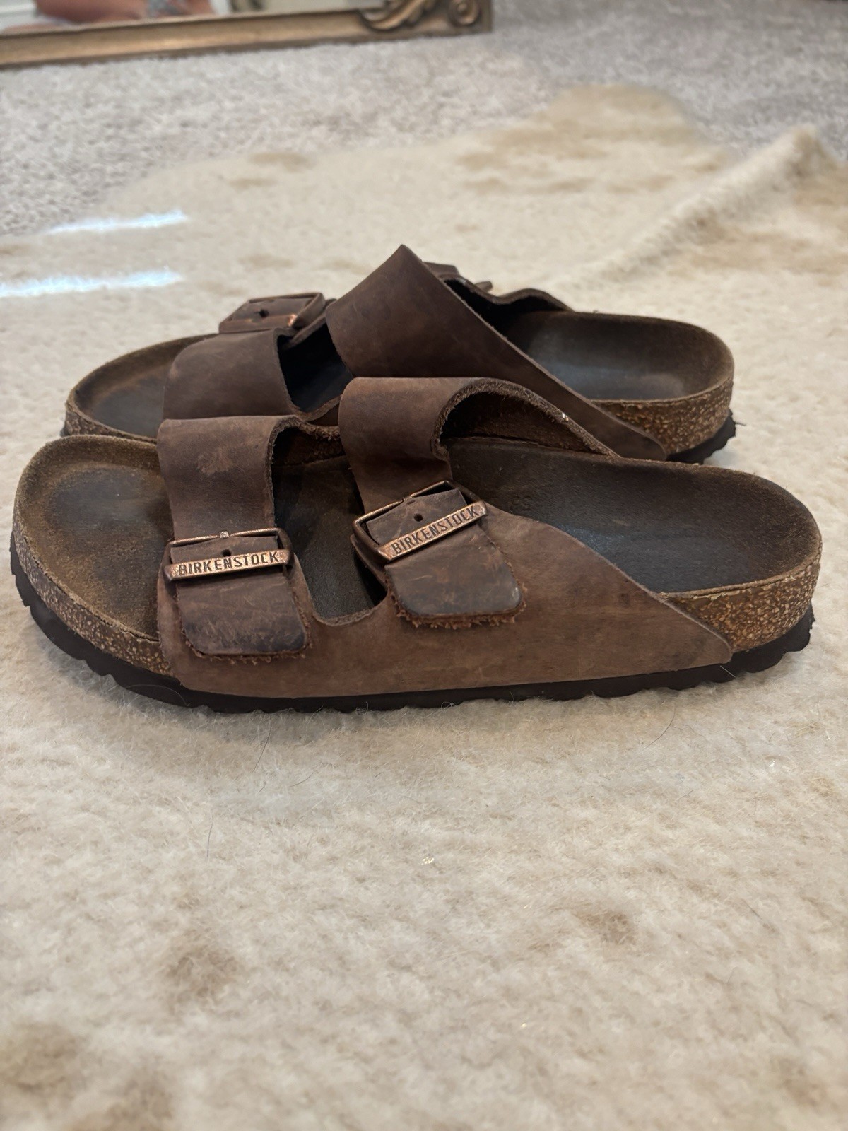 Size 37 Birkenstocks. Dark Colored With Gold Buckles.
