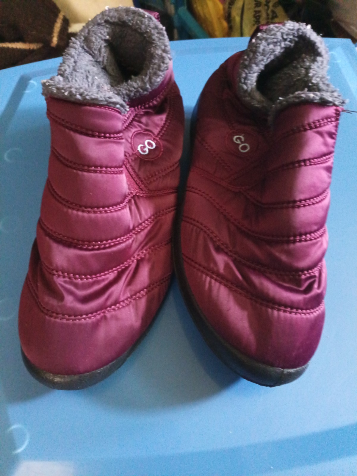 Go brand quilted maroon snow boots feature a plush faux fur lining and a slip-on