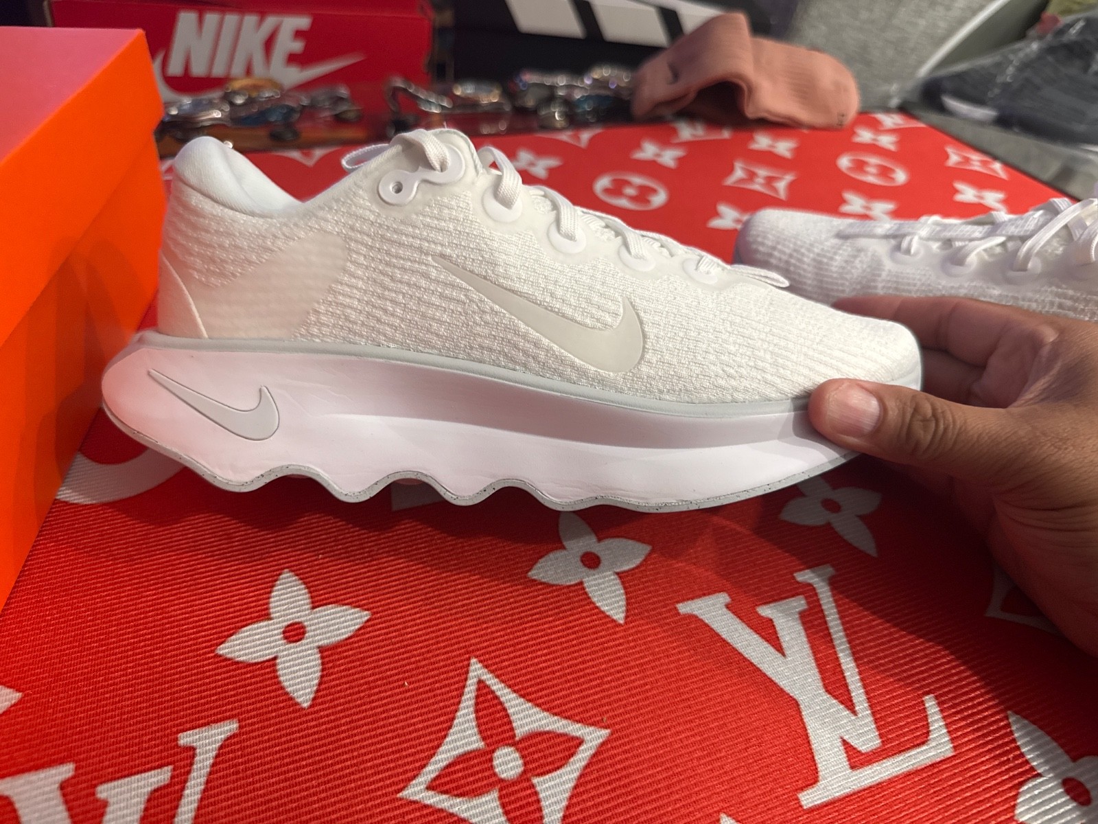 Nike Motiva walking shoe features a thick, sculpted sole designed for comfort