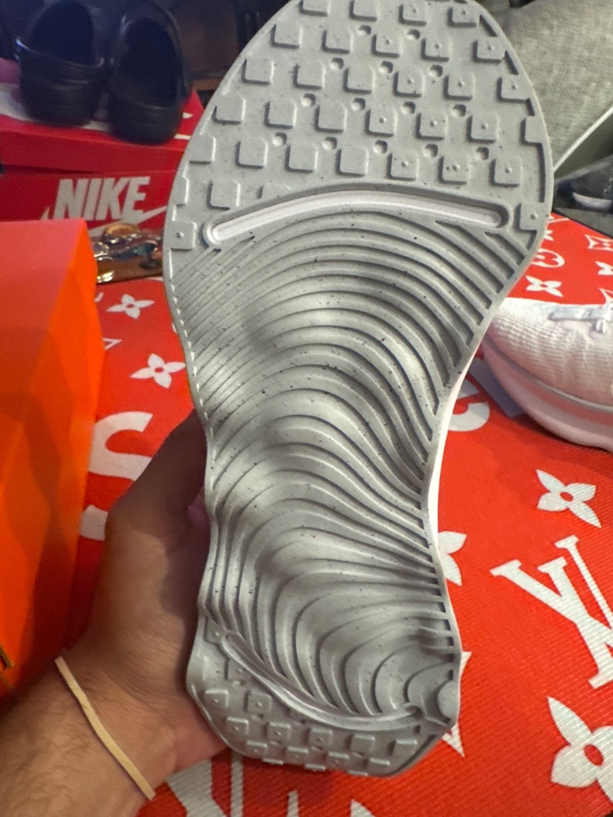 Nike Motiva walking shoe features a thick, sculpted sole designed for comfort