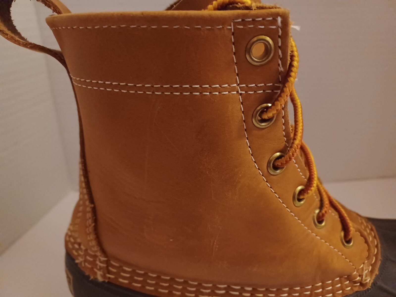 L.L. Bean Boots Duck Boots Feature A Lace Up Closure With Pull Tab On Back.
