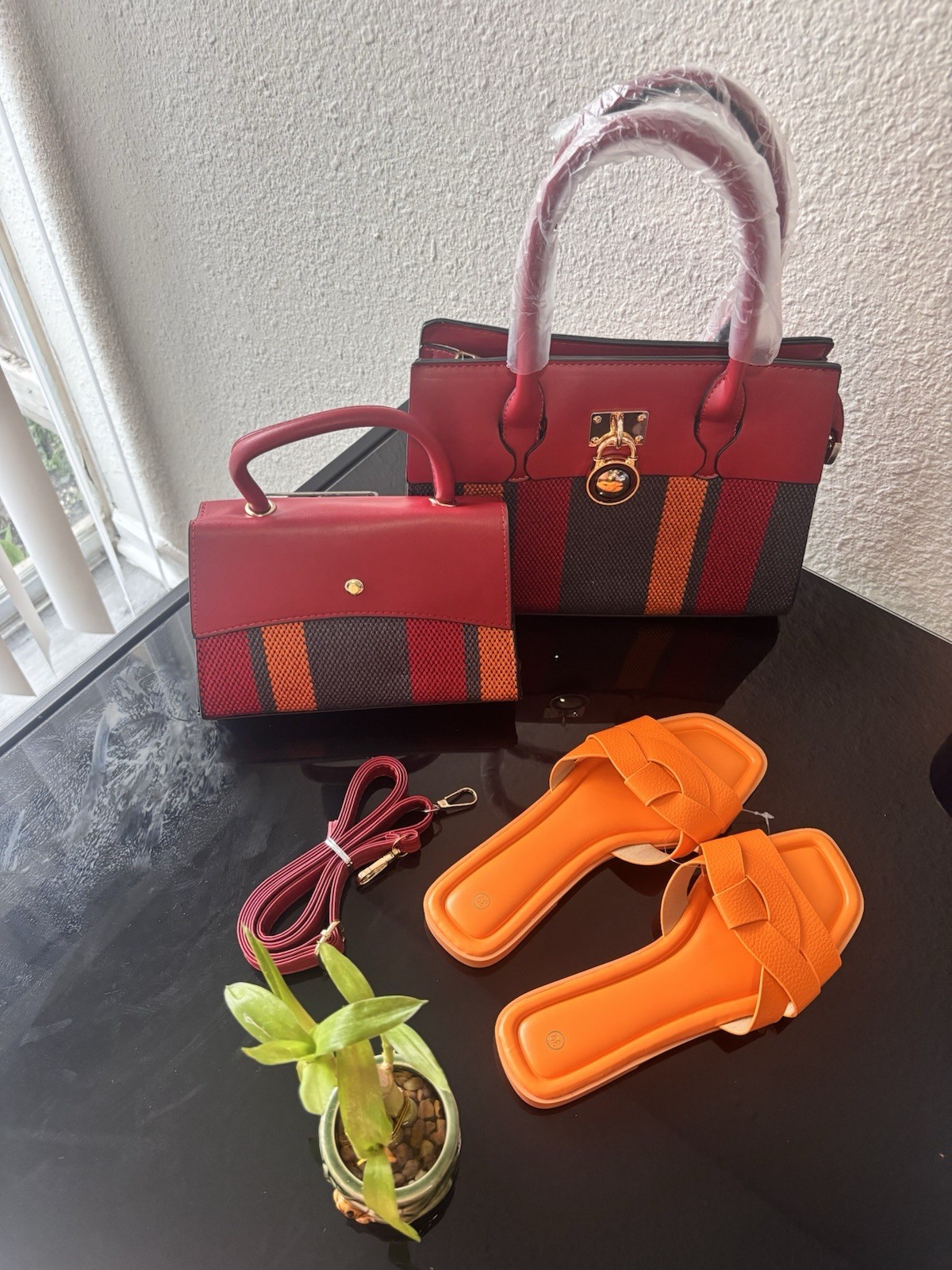 New women’s handbags and flat sandals. Available separately or as a set.