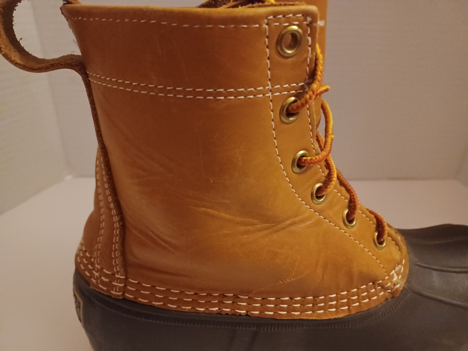 L.L. Bean Boots Duck Boots Feature A Lace Up Closure With Pull Tab On Back.