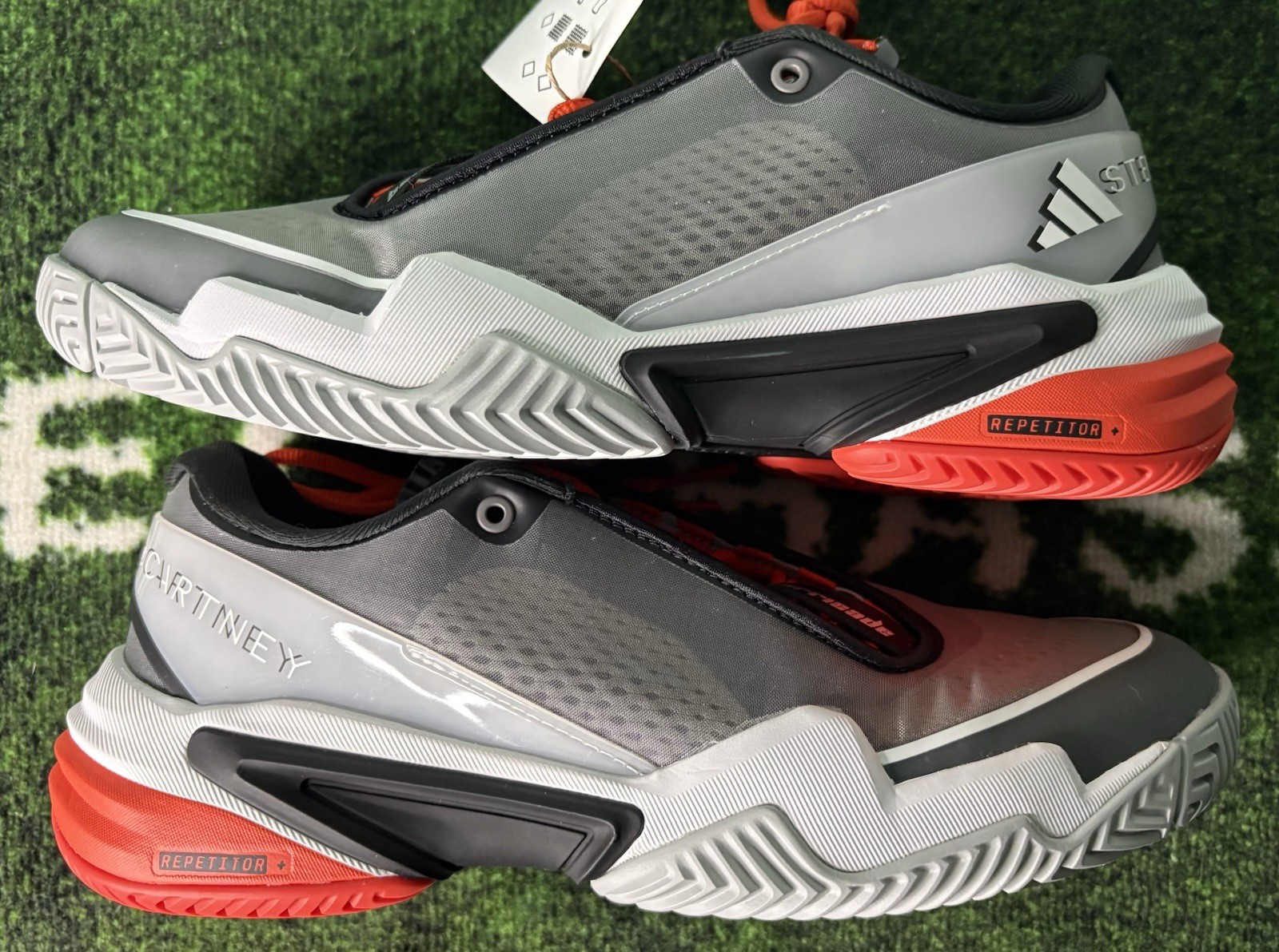 US W 8/M 7 – Stella McCartney x Adidas Barricade “Charcoal Orange” JR3285